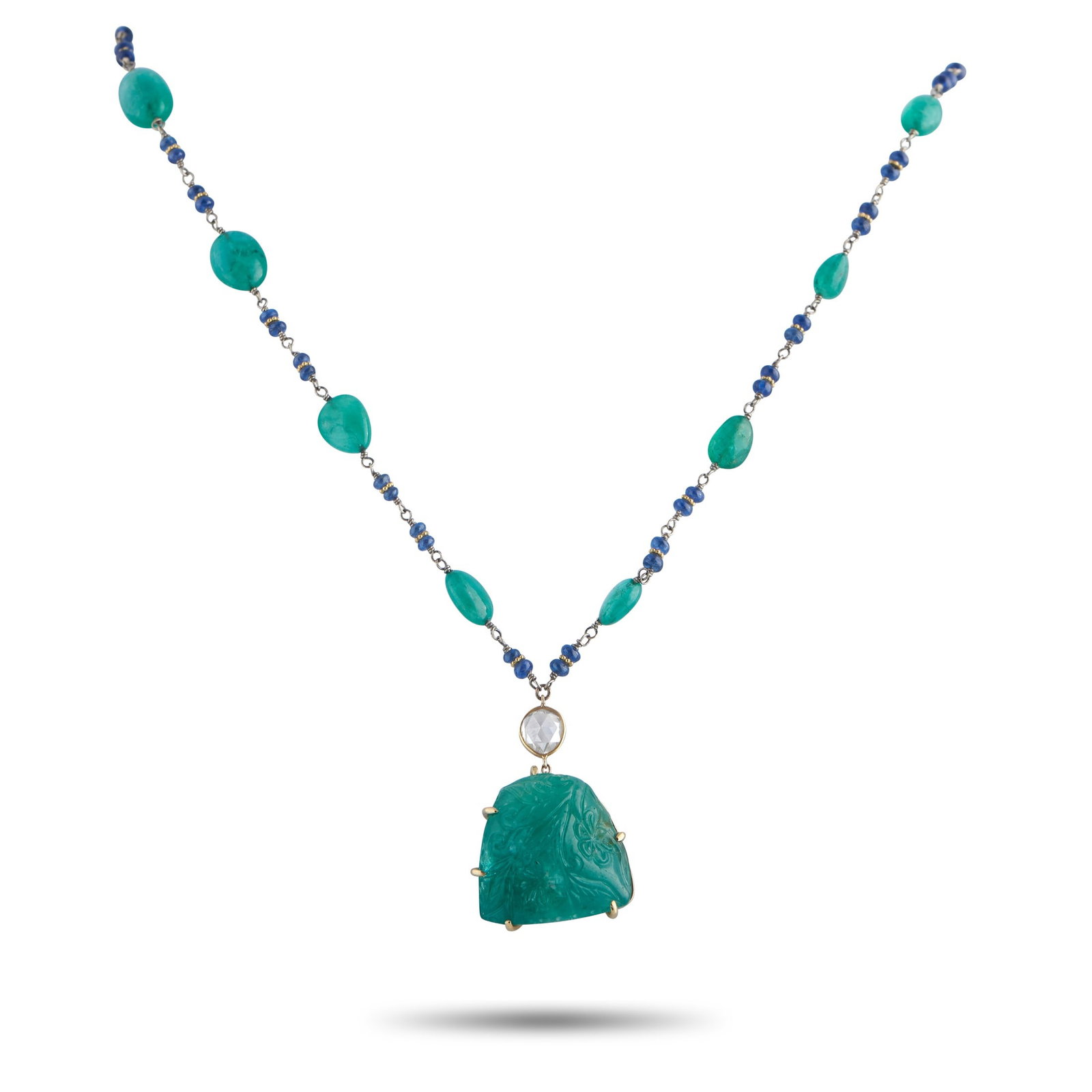 44.00ctw Emerald, 0.70ct Diamond, Sapphire, 18K Necklace: 44.00ctw Emerald, 0.70ct Rose-Cut Diamond, Blue Sapphire Bead and 18K Yellow Gold 22" Necklace - This distinctive necklace is an exploration of color, texture, and hand-worked detail, showcasing a rhy