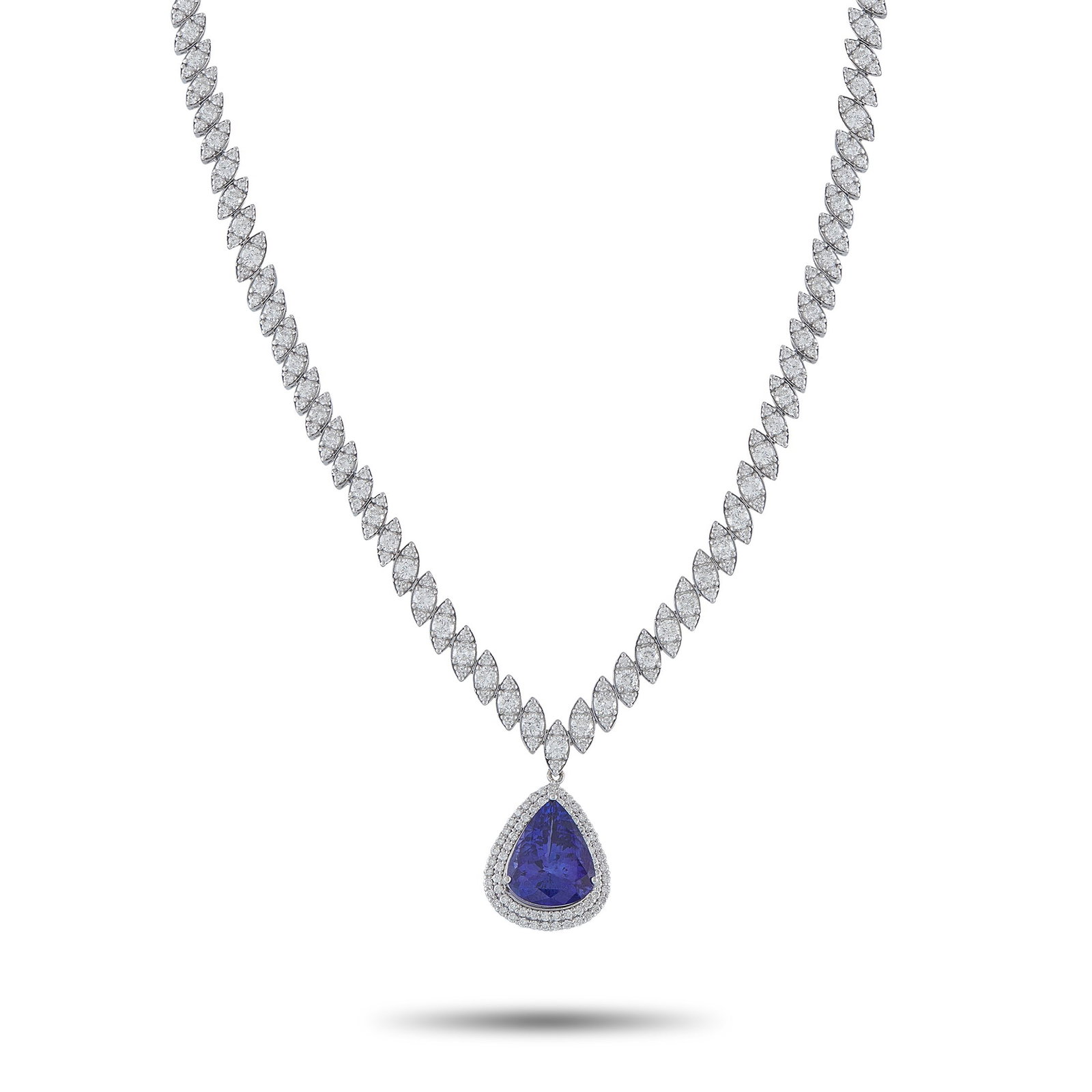 11.75ct Tanzanite, 10.00ctw Diamond and 18K Necklace: 11.75ct Tanzanite, 10.00ctw VS2-SI1/G-H Diamond and 18K White Gold 16" Necklace - Striking and undeniably elegant, this exceptional necklace is designed to shine at the most special occasions. Crafted