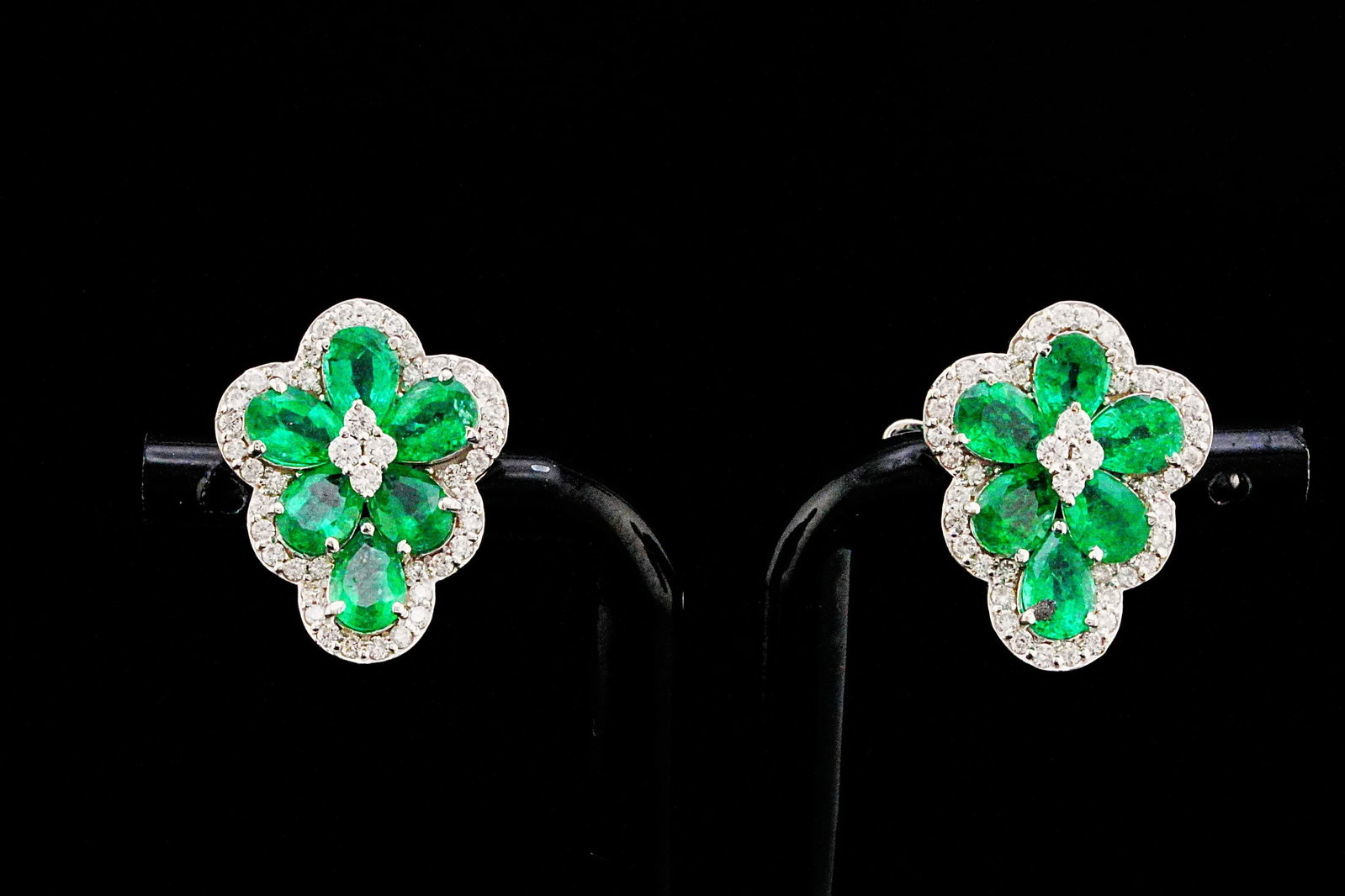 4.80ctw Emerald, 0.85ctw Diamond and 18K Earrings: 4.80ctw Emerald, 0.85ctw VS2-SI1/G-H Diamond and 18K White Gold 0.80" Cluster Earrings - THIS ITEM WILL COME WITH A $12,000 INSURANCE VALUATION REPORT. Delicate yet undeniably luxurious, these exquisi