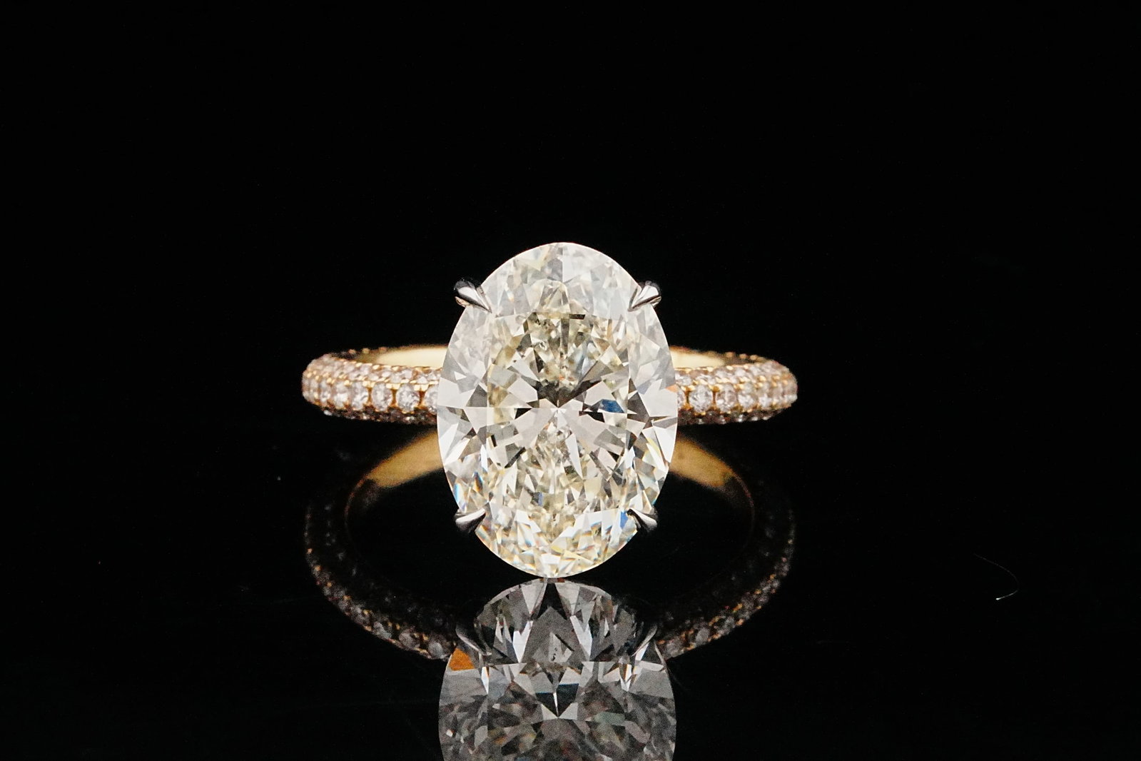 5.00ct Faint Yellow Diamond, 1.00ctw Diamond, 18K Ring: 5.00ct Faint Yellow Diamond, 1.00ctw SI1-SI2/G-H Diamond and 18K Yellow/White Gold Ring - THIS ITEM WILL COME WITH A $130,000 INSURANCE VALUATION REPORT. Showcasing remarkable presence and refined