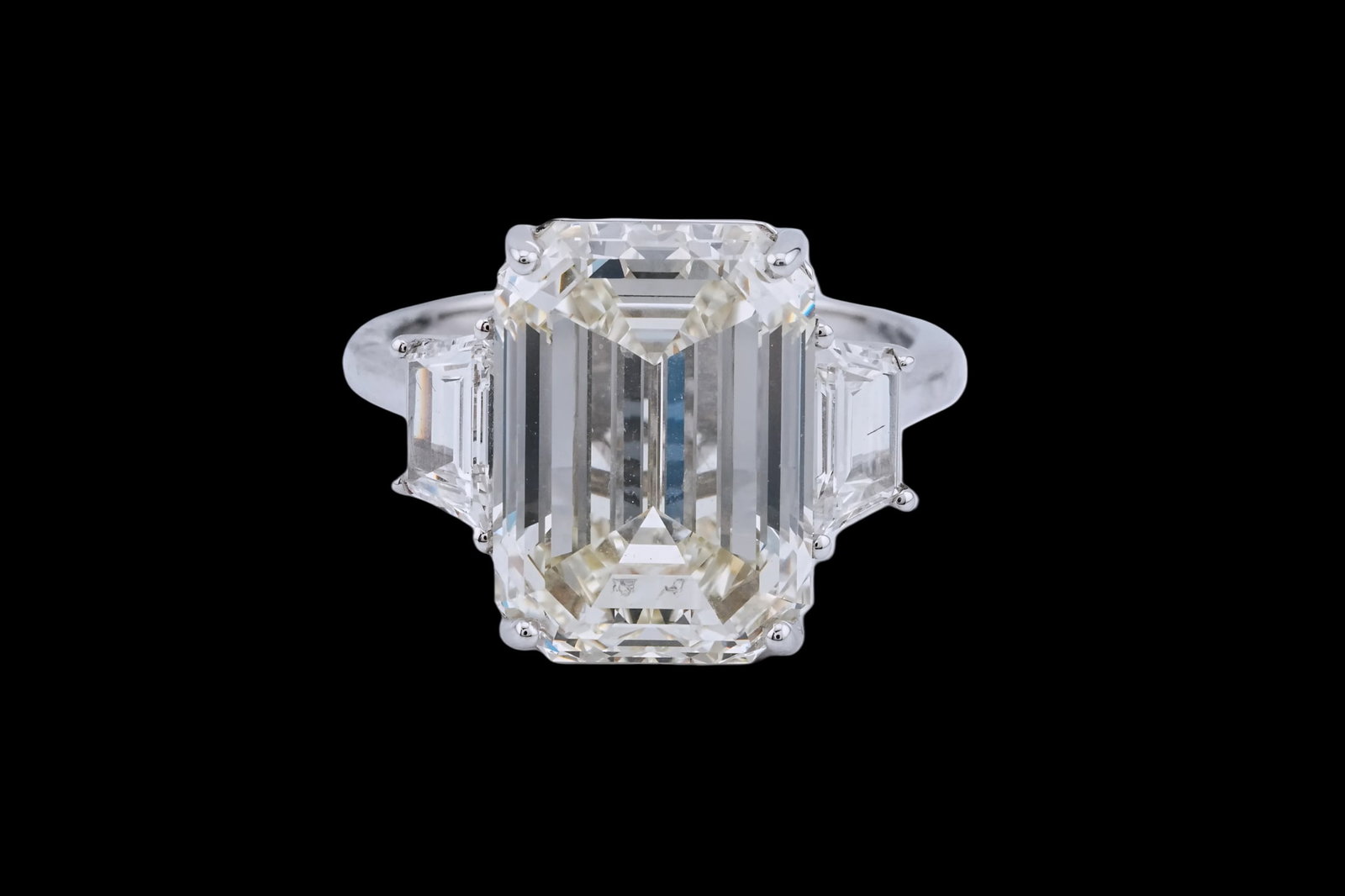 10.06ct GIA VVS2/M Diamond, 0.84ctw Diamond 18K Ring: 10.06ct GIA Certified VVS2/M Emerald Cut Diamond, 0.84ctw Diamond and 18K White Gold 3-Stone Ring - THIS ITEM WILL COME WITH AN $845,000 INSURANCE VALUATION REPORT. This exceptional three stone ring i