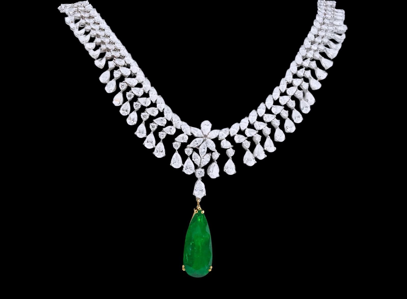 29.60ctw Diamond, 7.90ct Emerald and 18K 16" Necklace: 29.60ctw VS1-SI1/F-H Diamond, 7.90ct Pear Cut Emerald and 18K White/Yellow Gold 16" Cocktail Necklace - THIS ITEM WILL COME WITH A $257,000 INSURANCE VALUATION REPORT. An elegant and dramatic