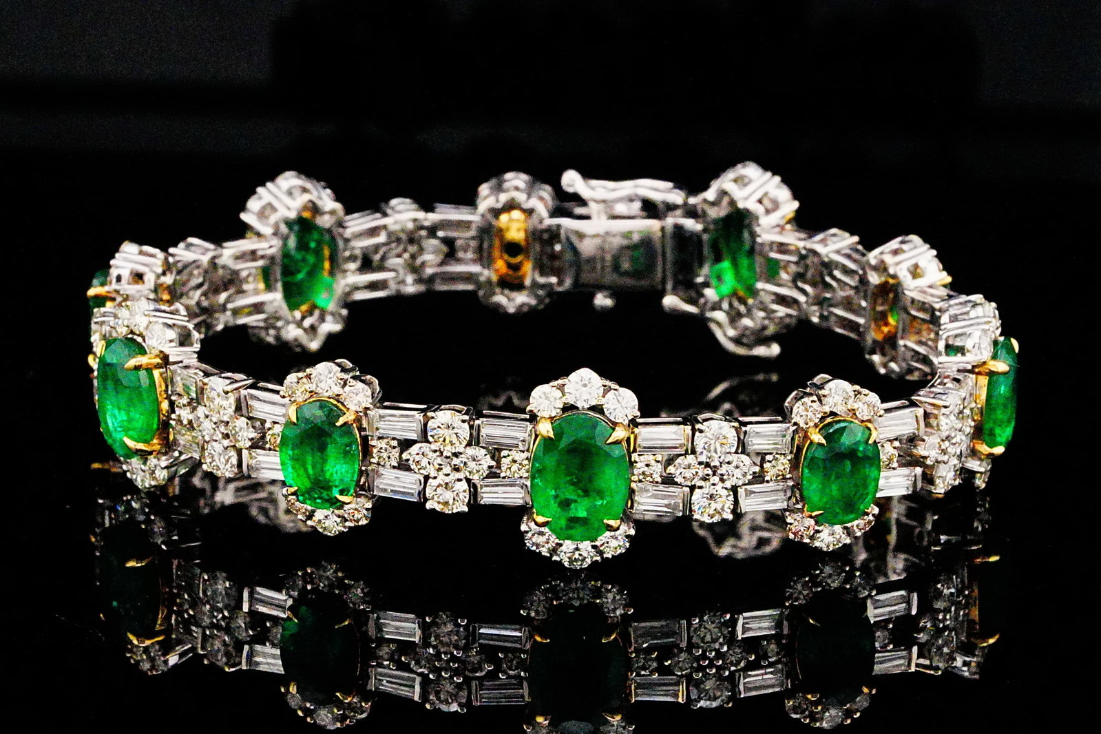 13.20ctw Emerald, 7.90ctw Diamond and 18K 7" Bracelet: 13.20ctw Emerald, 7.90ctw VS1-SI1/G-H Diamond and 18K White/Yellow Gold 7" Bracelet - THIS ITEM WILL COME WITH A $94,500 INSURANCE VALUATION REPORT. An extraordinary statement piece, this breathtaking