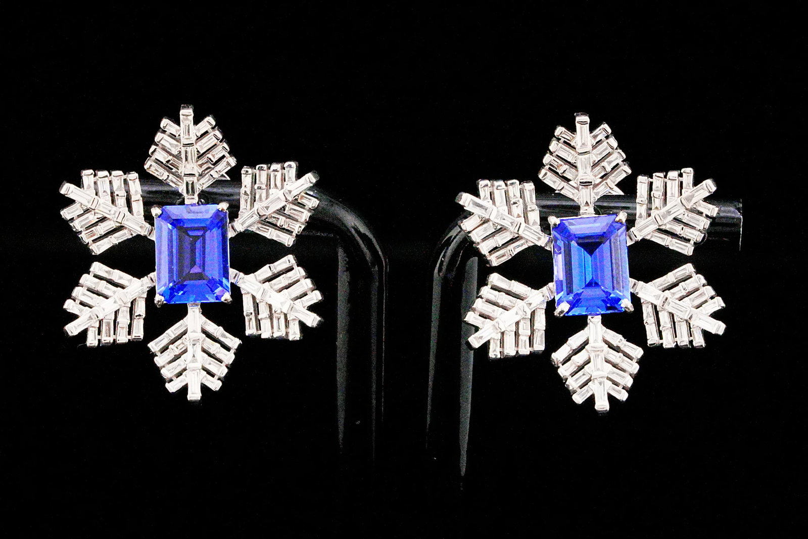 4.30ctw Tanzanite, 1.80ctw Diamond and 18K Earrings: 4.30ctw Tanzanite, 1.80ctw VS1-VS2/G-H Diamond and 18K White Gold 1.10" Snowflake Earrings - THIS ITEM WILL COME WITH A $21,500 INSURANCE VALUATION REPORT. Captivating and exceptionally elegant, these