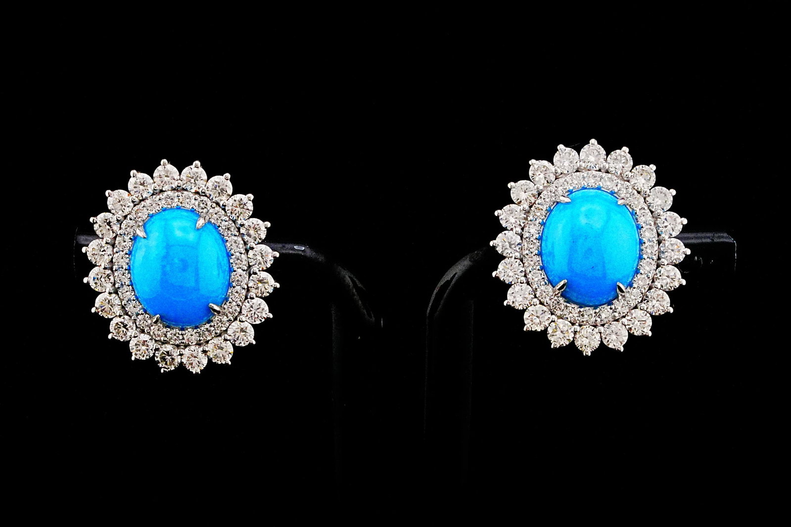 6.80ctw Turquoise, 3.00ctw Diamond and 18K Earrings: 6.80ctw Turquoise, 3.00ctw SI1-SI2/G-H Diamond and 18K White Gold 0.80" Earrings - THIS ITEM WILL COME WITH AN $11,000 INSURANCE VALUATION REPORT. Striking in both color and brilliance, these exceptio
