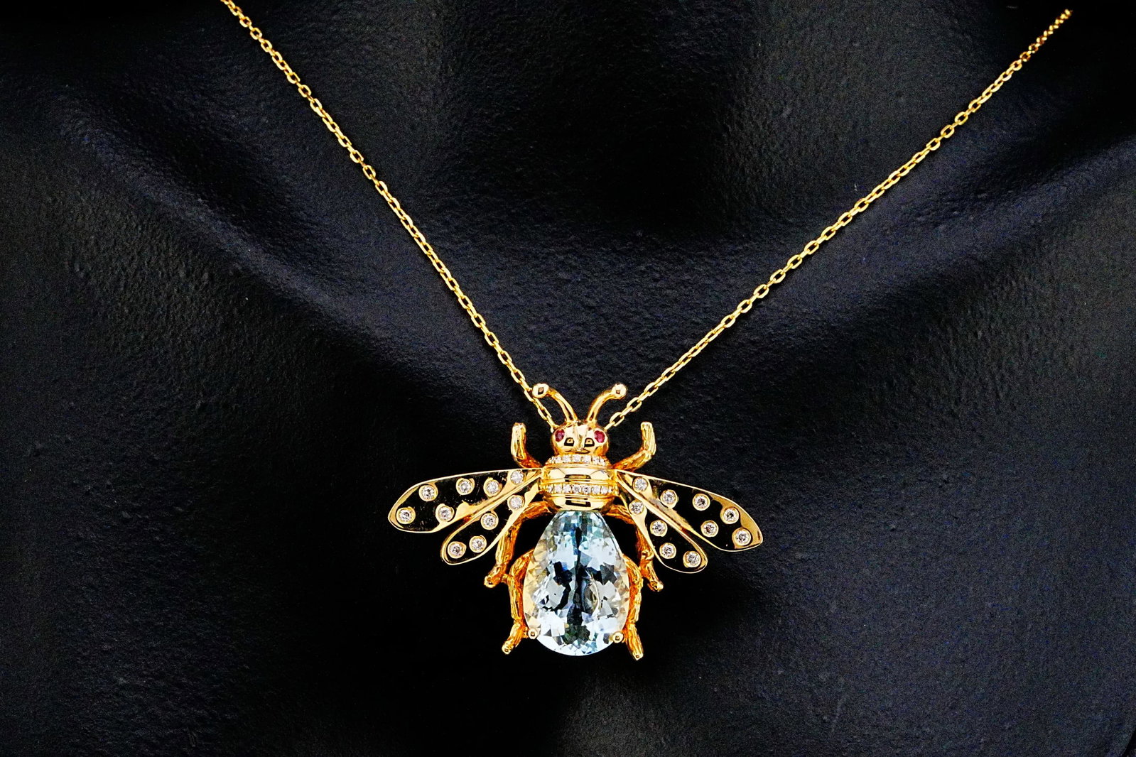 5.00ct Aquamarine, 0.20ctw Diamond and 14K 18" Necklace: 5.00ct Aquamarine, 0.20ctw Diamond and 14K Yellow Gold 18" Bee Pendant Necklace W/Ruby Accents - THIS ITEM WILL COME WITH A $19,500 INSURANCE VALUATION REPORT. Whimsical elegance meets exceptional cra