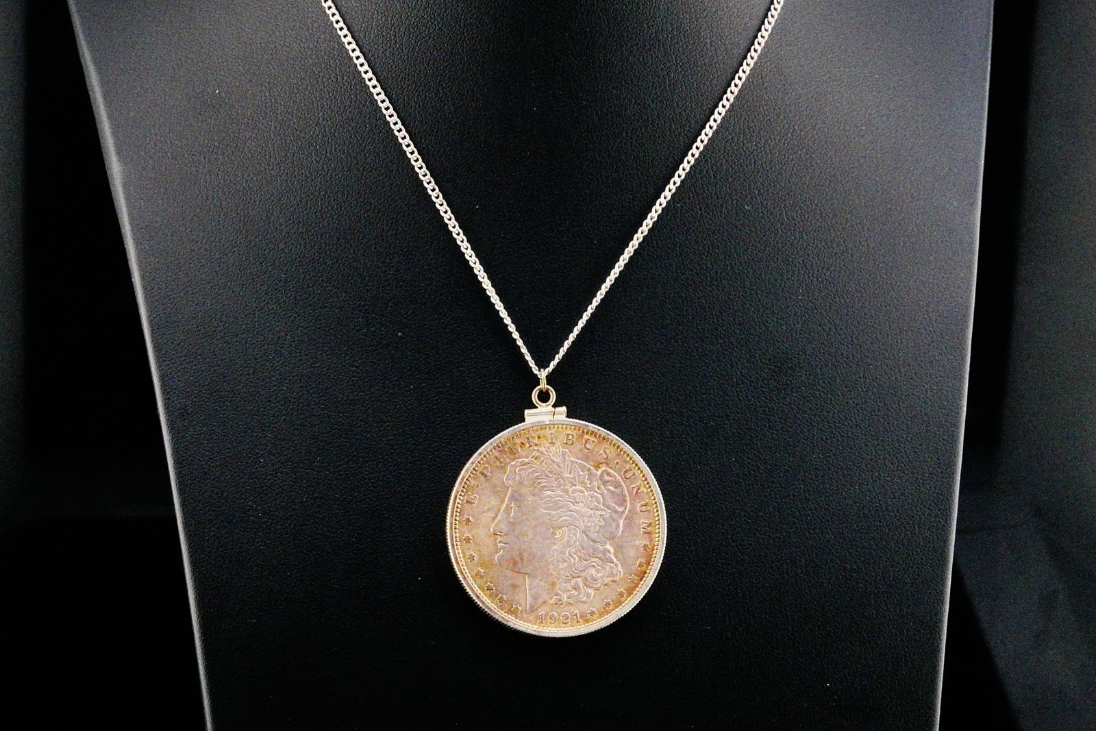 1921-P Morgan Silver Dollar Pendant W/24" Sterling Chain: 1921-P Morgan Silver Dollar Pendant on 24" Sterling Silver Chain - An iconic piece of American numismatic history transformed into a distinctive wearable collectible, this pendant showcases a genuine 