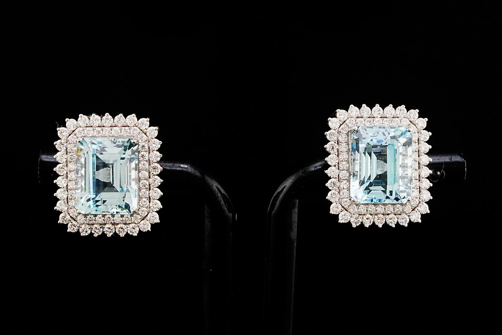 9.60ctw Aquamarine, 1.65ctw Diamond and 18K Earrings: 9.60ctw Aquamarine, 1.65ctw VS1-VS2/G-H Diamond and 18K White Gold 0.70" Earrings - THIS ITEM WILL COME WITH AN $18,000 INSURANCE VALUATION REPORT. Graceful, elegant, and exceptionally refined, these 