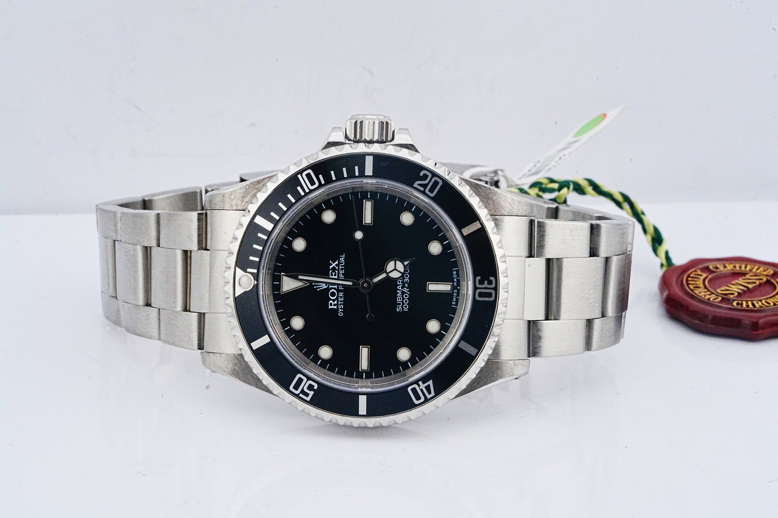 Rolex Submariner 40mm Stainless Steel Watch Ref. 14060: Rolex Oyster Perpetual Submariner 40mm Stainless Steel Watch W/Card Ref. 14060 - This handsome timepiece is the iconic Rolex Oyster Perpetual Submariner 40mm watch in solid stainless steel. There are 
