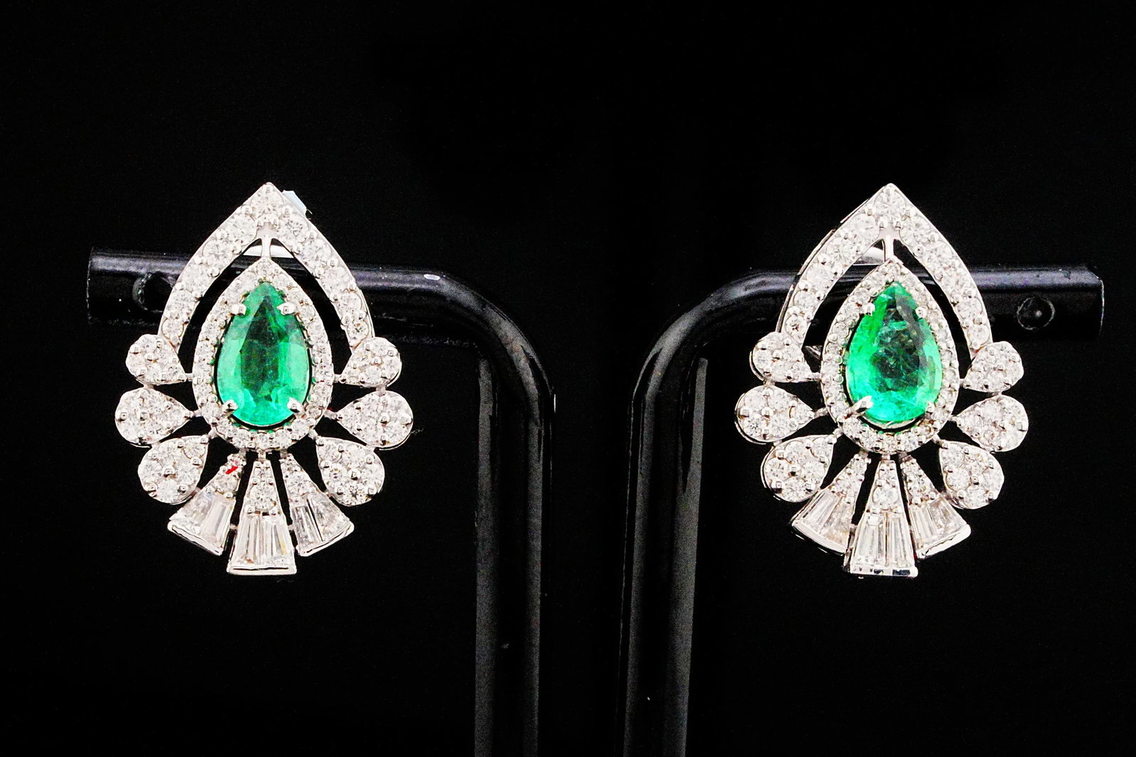 1.80ctw Emerald, 1.50ctw Diamond and 18K 1" Earrings: 1.80ctw Emerald, 1.50ctw VS1-SI1/G-H Diamond and 18K White Gold 1" Earrings - THIS ITEM WILL COME WITH A $15,500 INSURANCE VALUATION REPORT. A captivating blend of vivid color and exceptional brillian