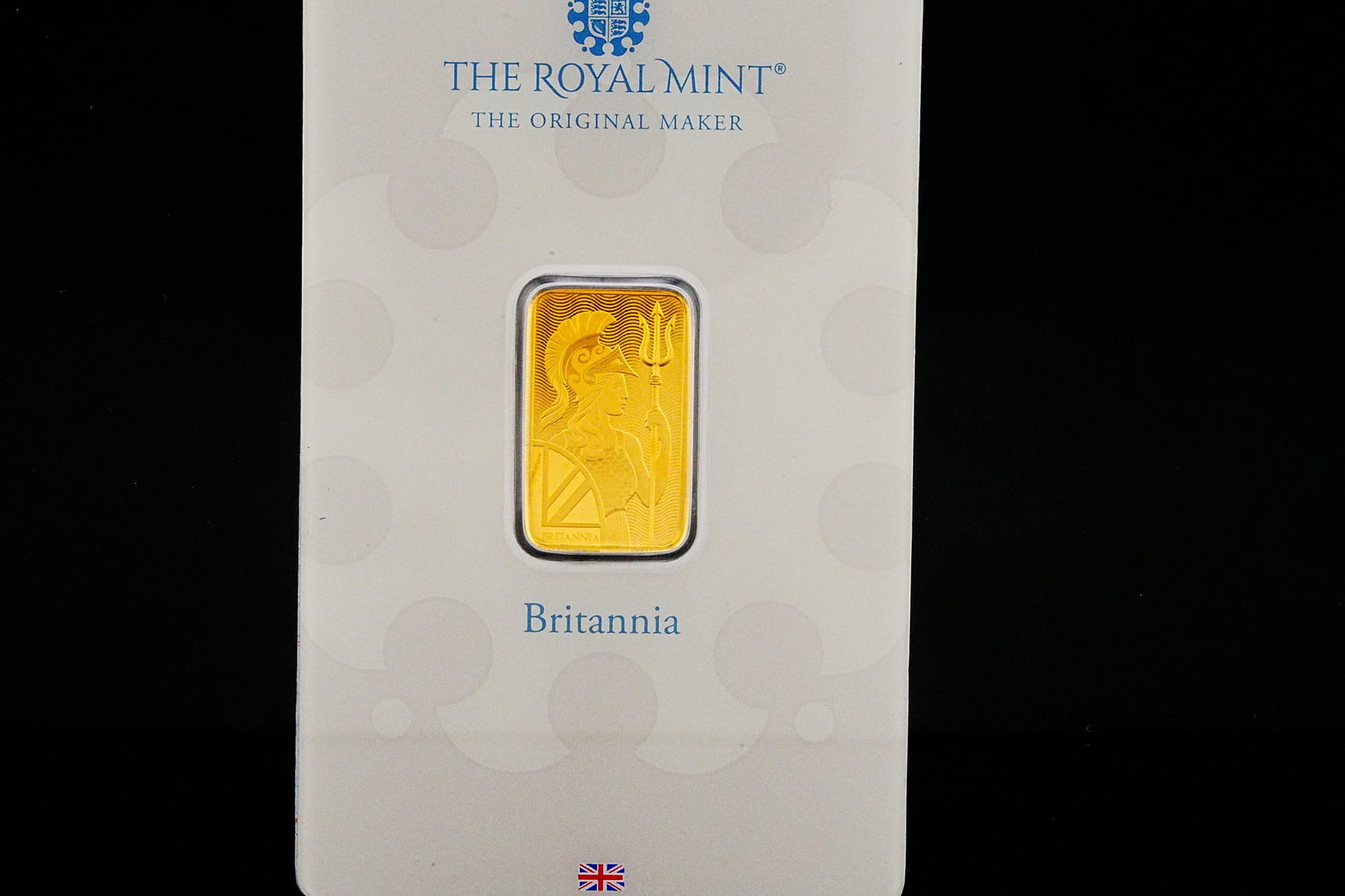 The Royal Mint 5 Gram .9999 Fine Gold Britannia Bar: The Royal Mint 5 Gram .9999 Fine Gold Britannia Bar in Assay Card - An elegant representation of British minting excellence and precious metal purity, this Royal Mint Britannia gold bar contains 5 gra