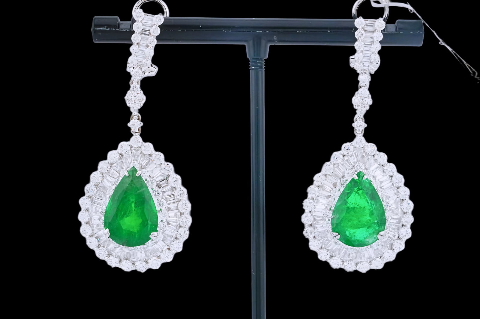 10.08ctw Emerald, 7.00ctw Diamond and 18K Earrings: 10.08ctw Emerald, 7.00ctw VS2-SI1/G-H Diamond and 18K White Gold 2" Drop Earrings - THIS ITEM WILL COME WITH A $65,000 INSURANCE VALUATION REPORT. An extraordinary pair of emerald and diamond drop ear