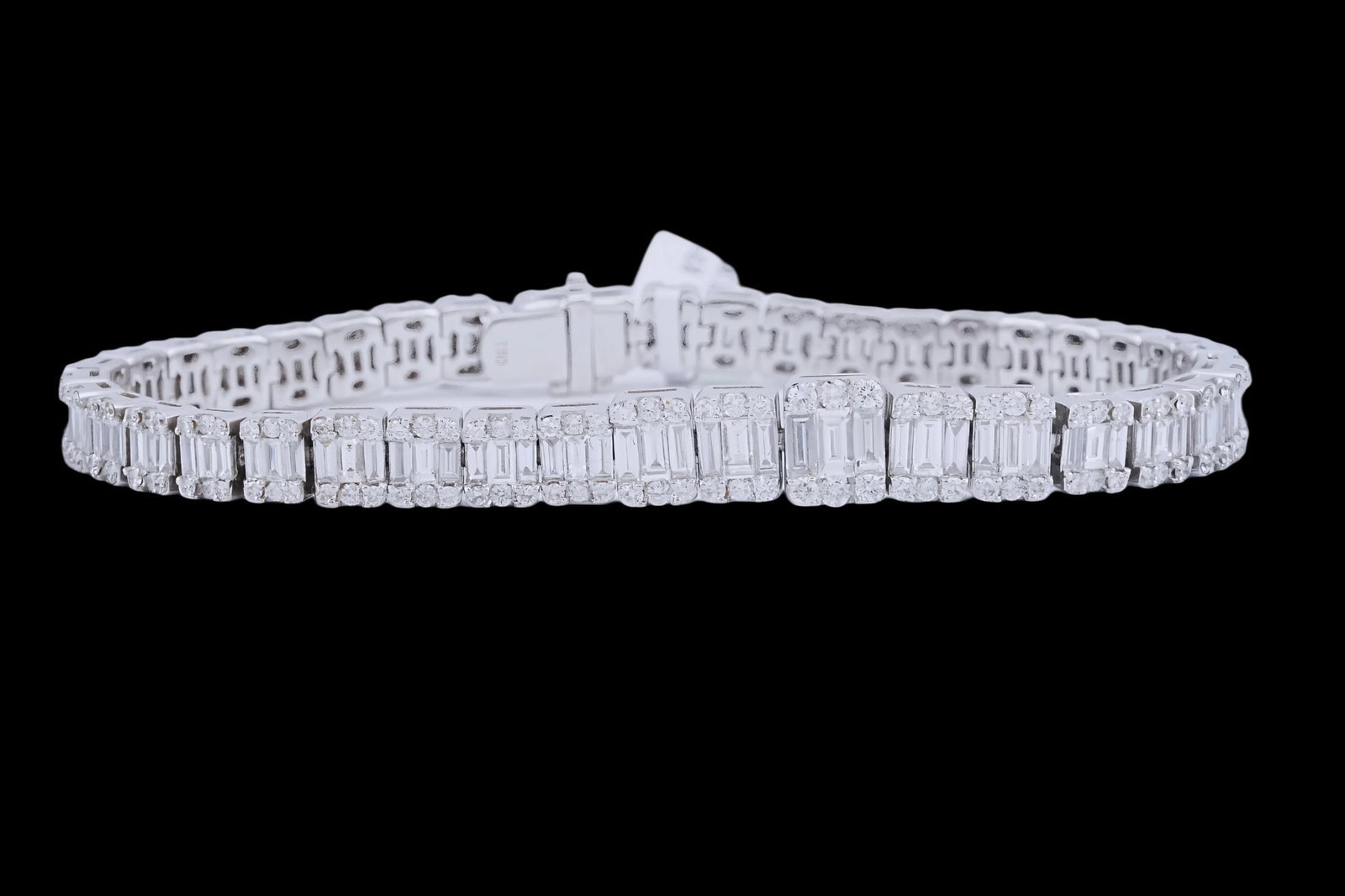 6.60ctw VS2-SI1/G-H Diamond and 18K 7.25" Bracelet: 6.60ctw VS2-SI1/G-H Diamond and 18K White Gold 7.25" Bracelet - THIS ITEM WILL COME WITH A $38,000 INSURANCE VALUATION REPORT. A sophisticated diamond bracelet crafted in polished 18K white gold, desi