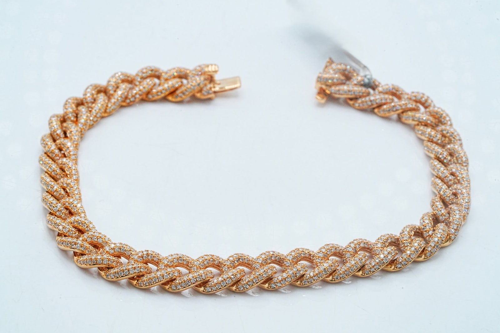 4.80ctw Diamond and 18K 7mm Wide Cuban Link Bracelet: 4.80ctw VS1-SI1/G-H Pave Diamond and 18K Yellow Gold 7mm Wide 7.5" Cuban Link Bracelet - THIS ITEM WILL COME WITH A $32,000 INSURANCE VALUATION REPORT. Crafted in rich 18K yellow gold, this classic Cu