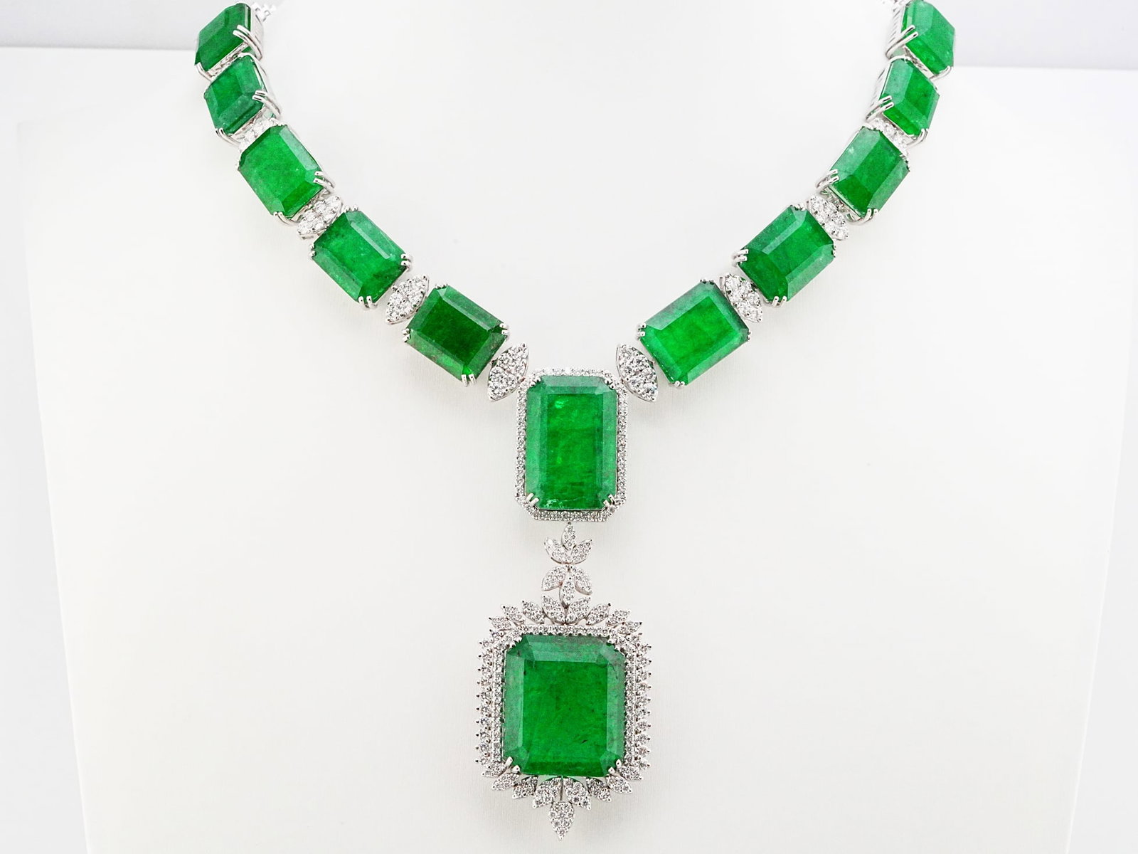 145.75ctw Emerald, 7.85ctw Diamond and 18K Necklace: 145.75ctw Emerald, 7.85ctw VS1-VS2/G-H Diamond and 18K White Gold 16.5" Statement Necklace - THIS ITEM WILL COME WITH A $220,000 INSURANCE VALUATION REPORT. An extraordinary creation of exceptional sc