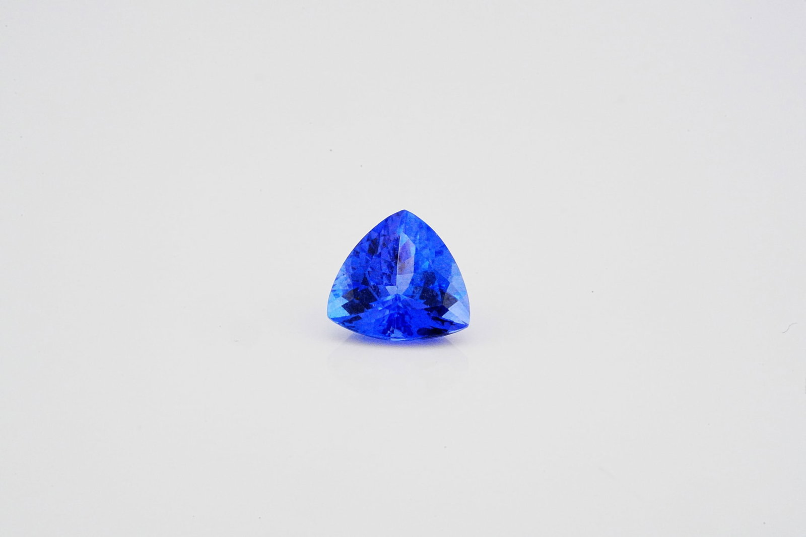 2.30ct Trillion-Cut Tanzanite: 2.30ct Trillion-Cut Tanzanite - This exceptional loose tanzanite showcases an approximately 2.30 carat trillion-cut gemstone of remarkable beauty and brilliance. Displaying a captivating blend of rich