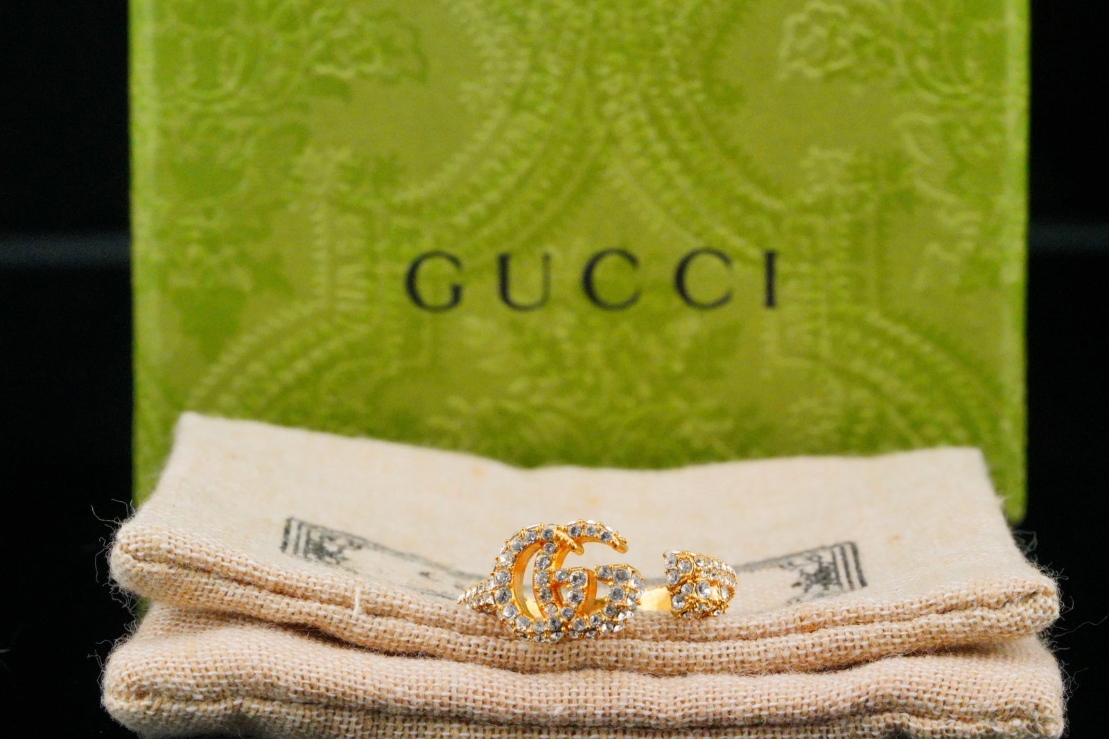 Gucci Gold Tone Double G Key Ring With Crystals: Gucci Gold Tone Double G Key Ring With Crystals (Never Used W/Pouch and Box) - This beautiful Gucci ring has an antiques-inspired design in the shape of a barrel key defined by a Double G head. The ri