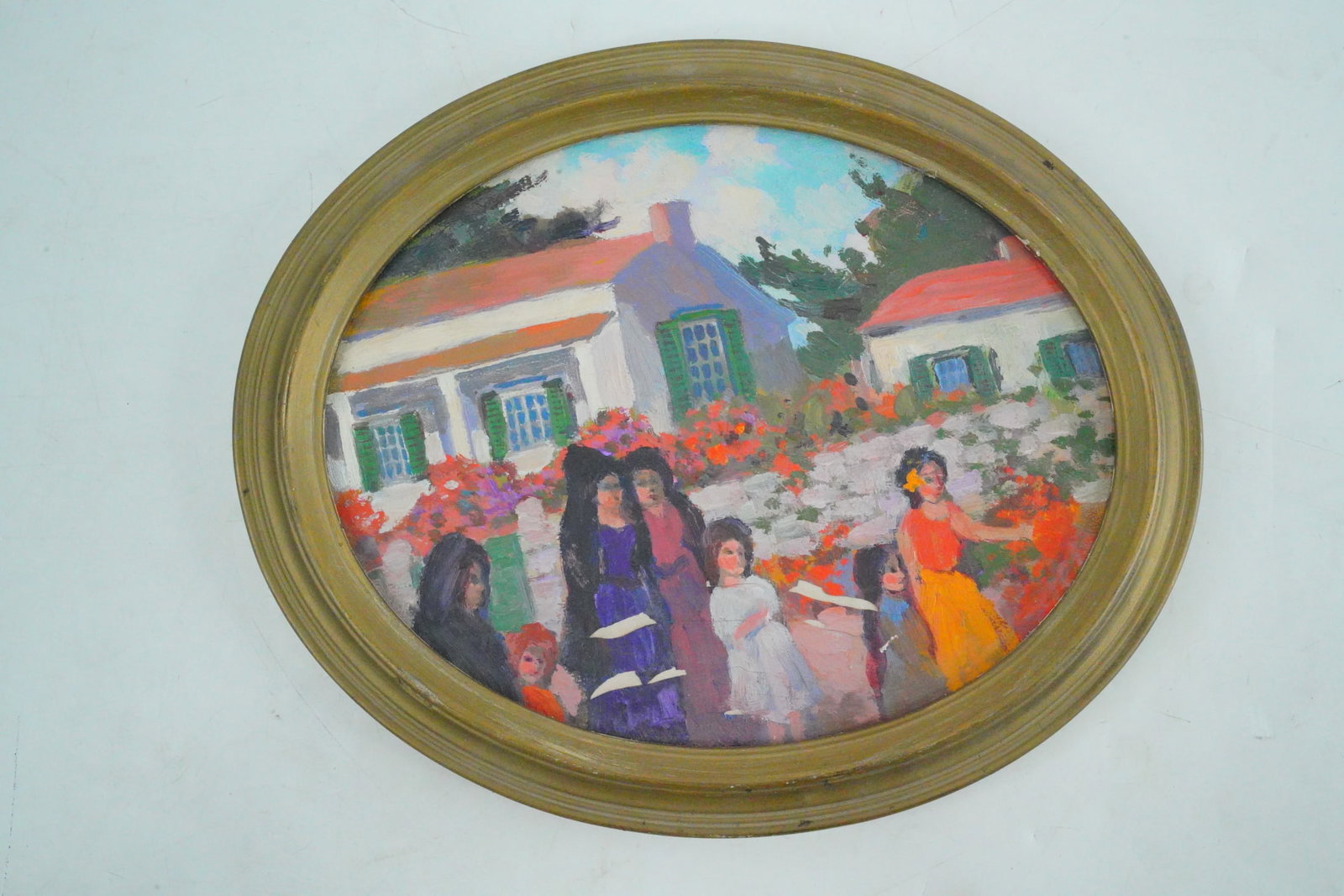 Village Scene with Figures in Garden, Oil on Board: Village Scene with Figures in Garden, Oil on Board (Oval Format) - A vibrant and charming painting depicting a lively garden scene with women and children gathered in front of whitewashed cottages wit