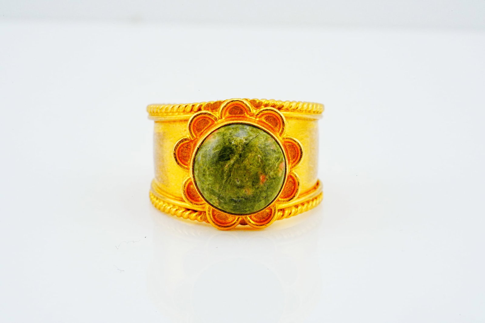 21K Yellow Gold and Unakite Adjustable Ring: 21K Yellow Gold and Unakite Adjustable Ring - Elegantly crafted in rich 21K yellow gold, this striking adjustable ring features a substantial polished unakite cabochon displaying an earthy blend of mo