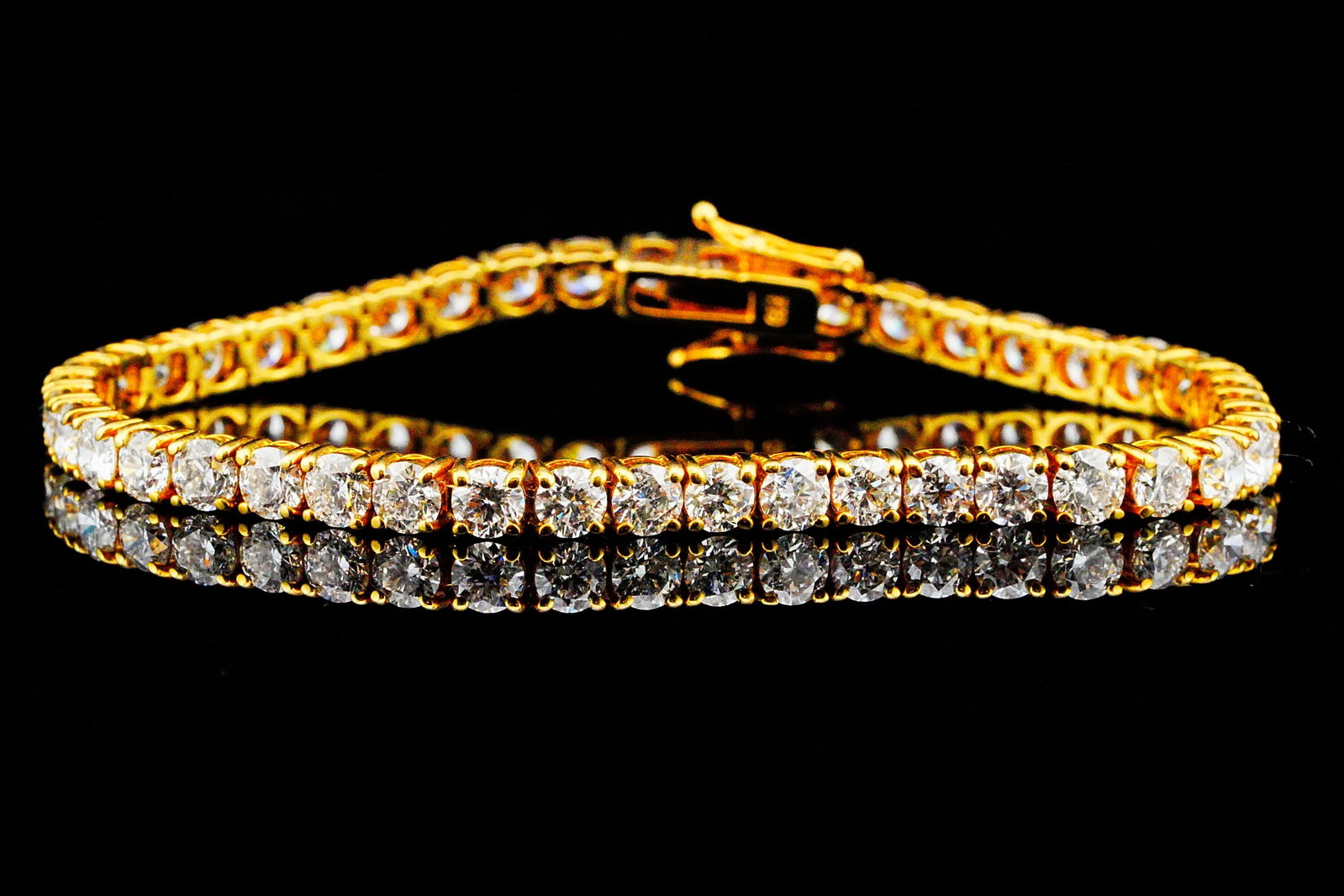 11.00ctw Diamond and 18K Yellow Gold 7" Tennis Bracelet: 11.00ctw VS1-SI1/G-H Diamond and 18K Yellow Gold 7" Tennis Bracelet - A timeless expression of luxury, this exceptional tennis bracelet is masterfully crafted in rich 18K yellow gold and showcases app