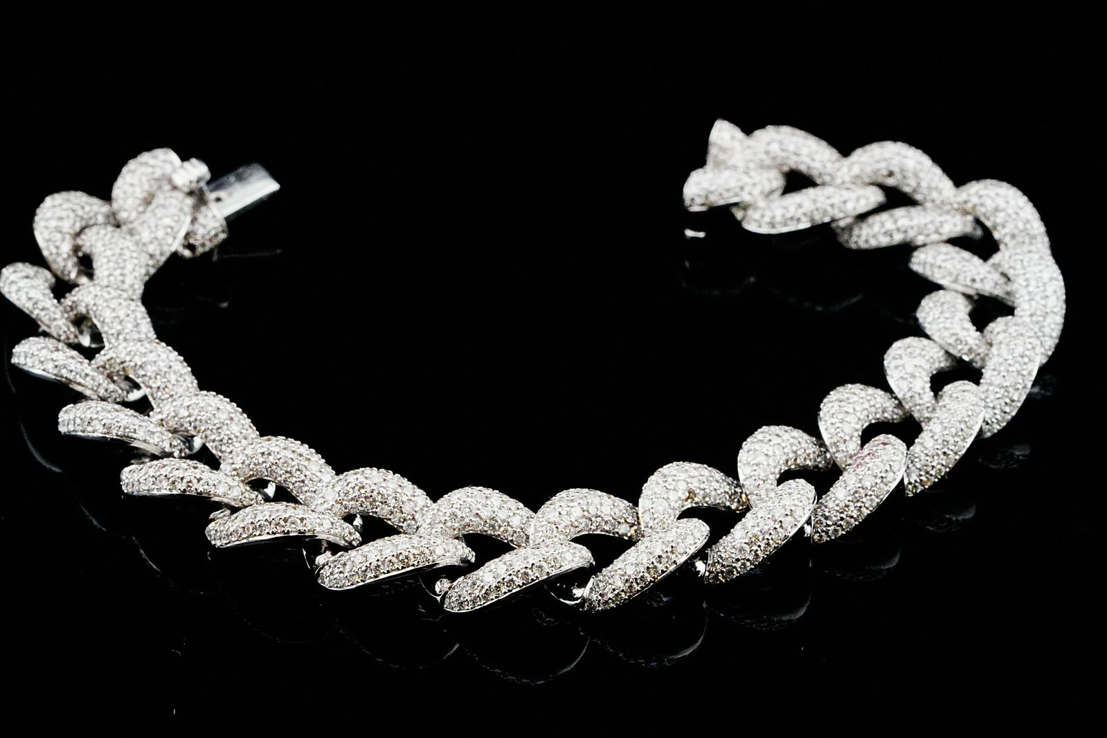 12.30ctw Diamond and 18K White Gold 14mm Wide Bracelet: 12.30ctw VS1-SI1/G-H Pave Diamond and 18K White Gold 14mm Wide 7.5" Cuban Link Bracelet - THIS ITEM WILL COME WITH A $55,000 INSURANCE VALUATION REPORT. A powerful expression of modern luxury, this Cu