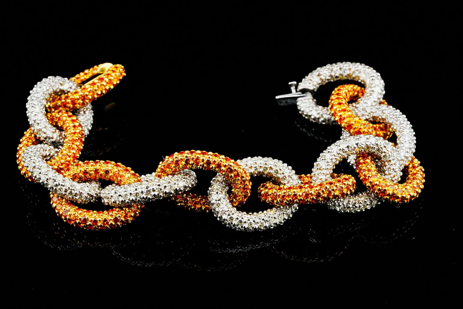 27.85ctw Yellow Sapphire, 20.90ctw Diamond 18K Bracelet: 27.85ctw Yellow Sapphire, 20.90ctw VS1-SI1/G-H Diamond and 18K Yellow/White Gold 7.5" Bracelet - THIS ITEM WILL COME WITH A $71,500 INSURANCE VALUATION REPORT. This striking bracelet is crafted in a b