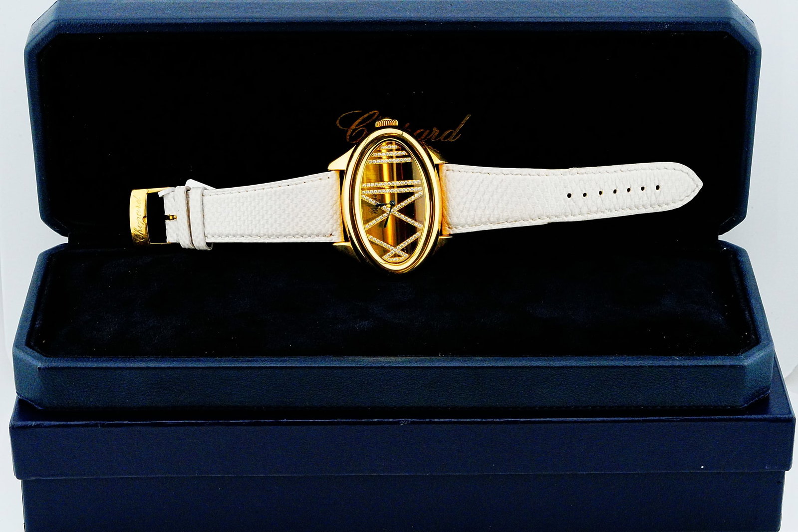 Chopard Montres Dame Cat Eye 18K and Diamond Watch: Chopard Montres Dame Cat Eye 18K Yellow Gold and Diamond Watch W/Leather Strap, Chopard Box Ref. 5300 - An exceptionally distinctive Chopard Montres Dame Cat Eye timepiece, reference 5300, featuring a