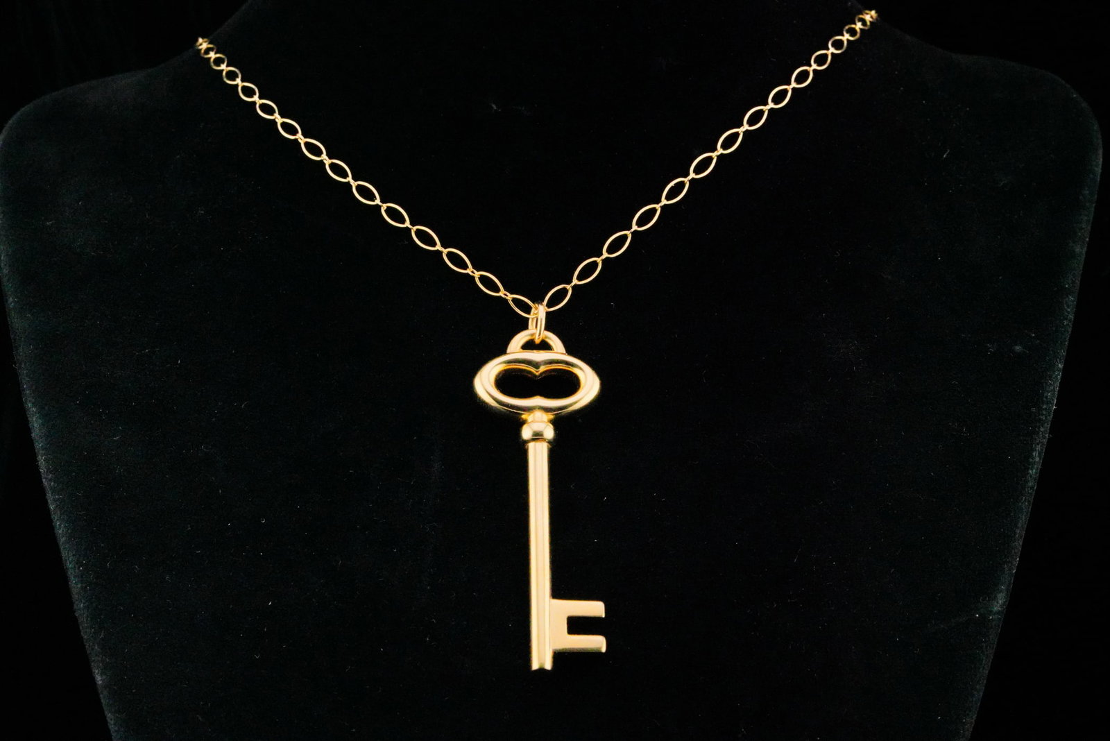 Tiffany & Co. 18K Yellow Gold 20" Large Key Necklace: Tiffany & Co. 18K Yellow Gold 20" Large Key Pendant Necklace W/Box - A classic and elegant Tiffany & Co. design, featuring a slender key-form pendant suspended from a fine link chain. Crafted in solid
