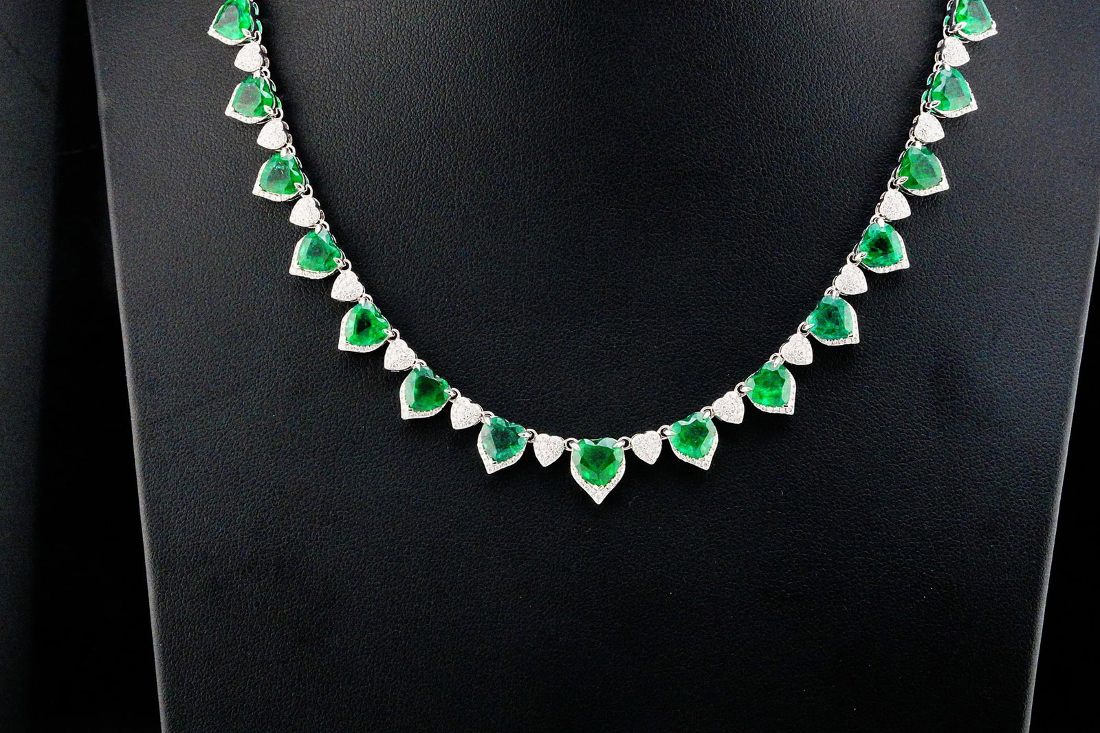 16.20ctw Emerald, 1.50ctw Diamond and 18K 16.5" Necklace: 16.20ctw Emerald, 1.50ctw VS1-SI1/G-H Diamond and 18K White Gold 16.5" Necklace - THIS ITEM WILL COME WITH A $61,000 INSURANCE VALUATION REPORT. A refined celebration of elegance and exceptional craft