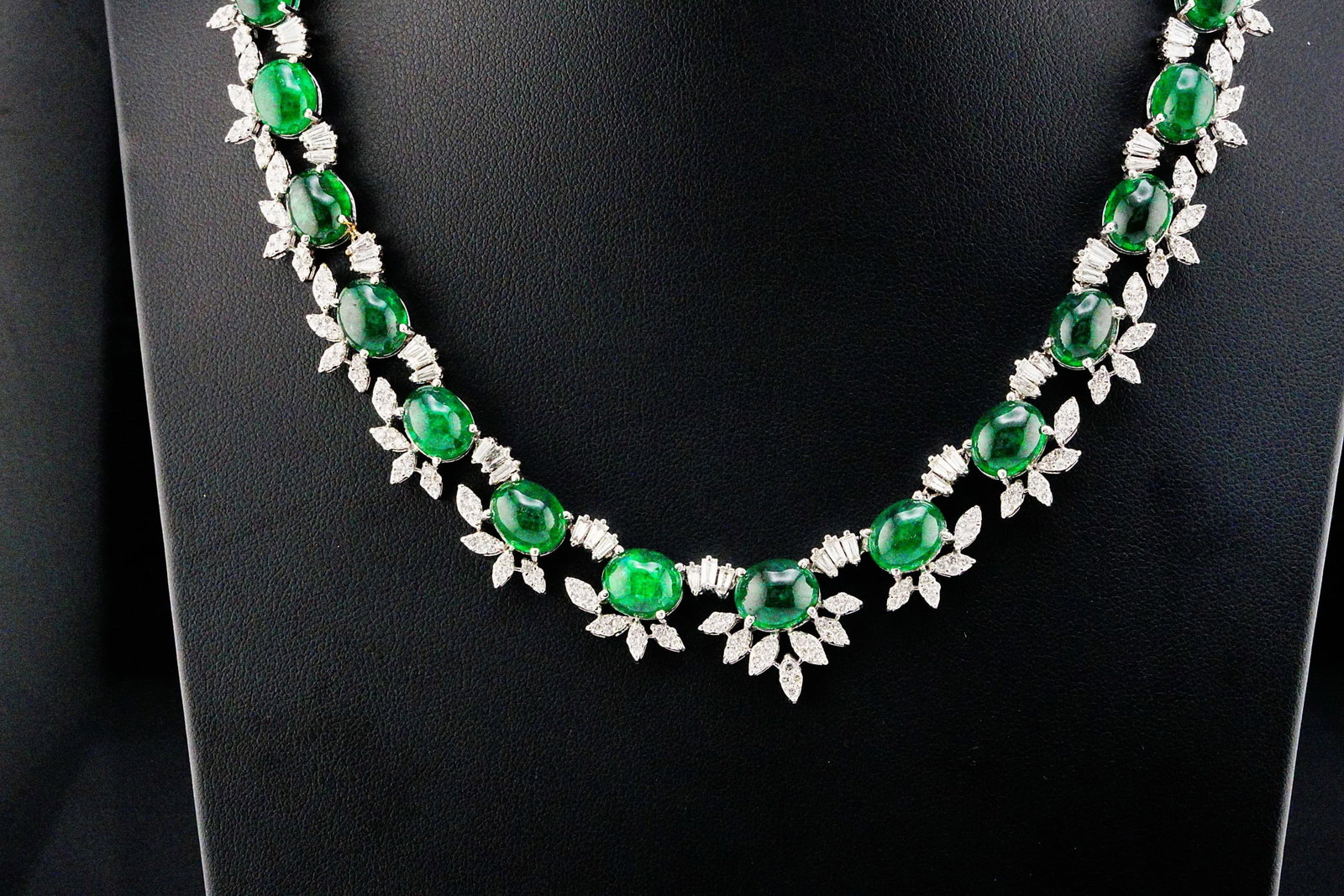 83.00ctw Emerald, 8.50ctw Diamond and 18K 16" Necklace: 83.00ctw Cabochon Emerald, 8.50ctw VS1-SI1/G-H Diamond and 18K White Gold 16" Necklace - THIS ITEM WILL COME WITH A $94,000 INSURANCE VALUATION REPORT. This breathtaking 18K white gold necklace showca