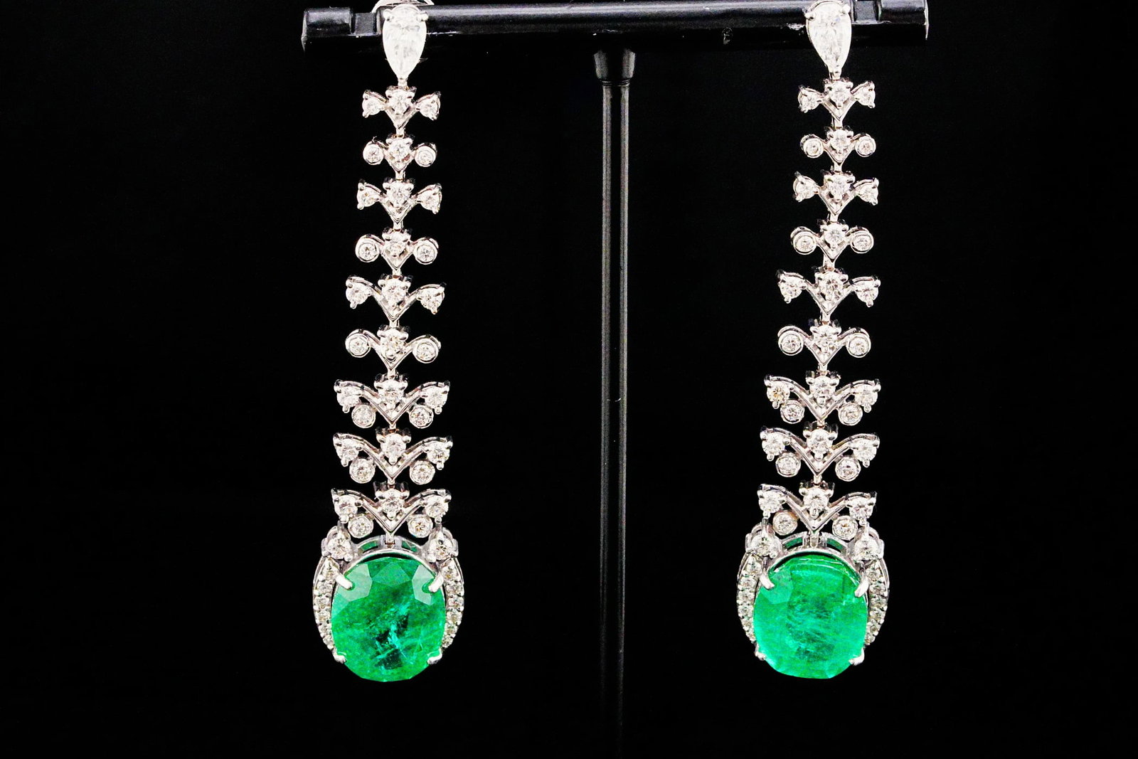 15.40ctw Emerald, 3.50ctw Diamond and 18K 2.60" Earrings: 15.40ctw Emerald, 3.50ctw VS1-VS2/G-H Diamond and 18K White Gold 2.60" Dangle Earrings - THIS ITEM WILL COME WITH A $54,000 INSURANCE VALUATION REPORT. A breathtaking display of color and elegance, th