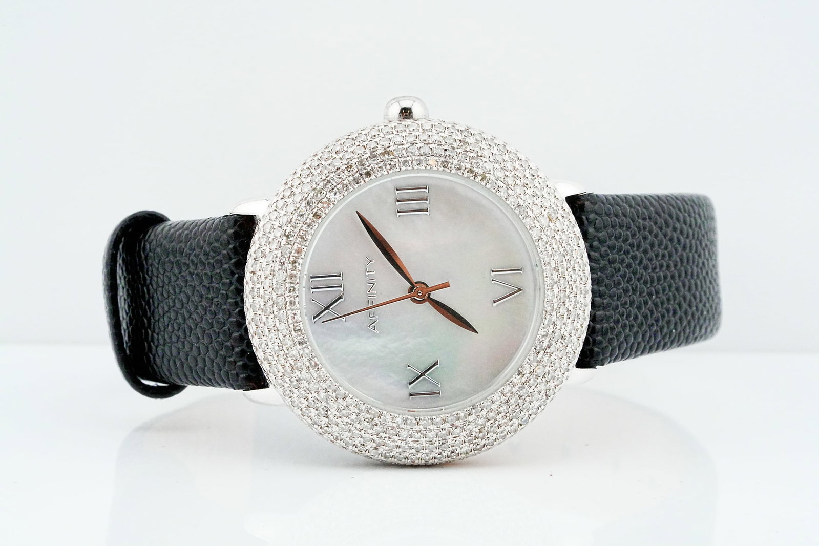 Affinity 36mm Stainless Steel Pave Diamond Bezel Watch: Affinity 36mm Stainless Steel Pave Diamond Bezel Watch W/Stingray Band and Mother of Pearl Dial - An elegant and distinctive timepiece from Affinity, featuring a luminous mother of pearl dial framed b