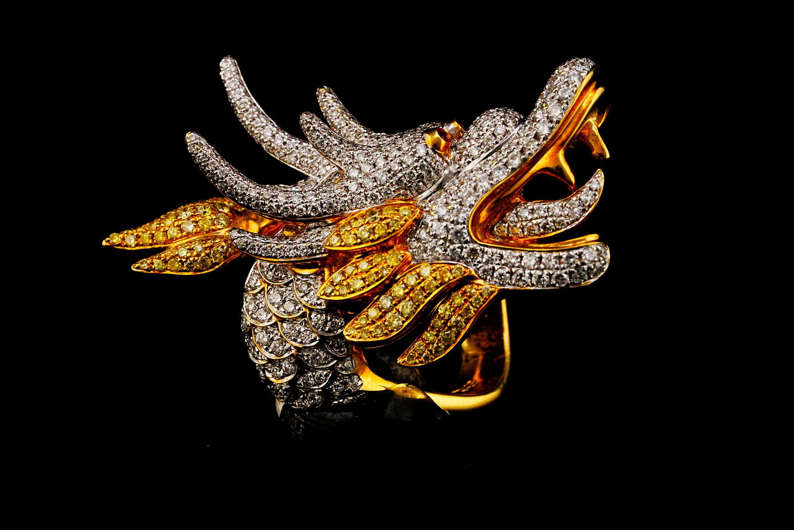 4.25ctw Yellow and White Diamond 18K Dragon Ring: 4.25ctw Yellow and White Diamond 18K Yellow Gold Sculptural Dragon Ring W/Ruby Accents - THIS ITEM WILL COME WITH A $38,500 INSURANCE VALUATION REPORT. A bold celebration of mythological artistry and