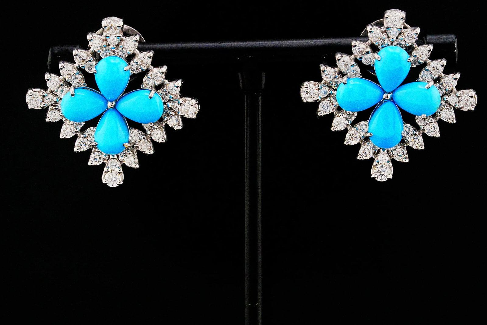 5.00ctw Turquoise, 2.60ctw Diamond and 18K 1" Earrings: 5.00ctw Turquoise, 2.60ctw VS1-VS2/G-H Diamond and 18K White Gold 1" Earrings - THIS ITEM WILL COME WITH A $14,000 INSURANCE VALUATION REPORT. Bursting with vibrant color and timeless elegance, these 