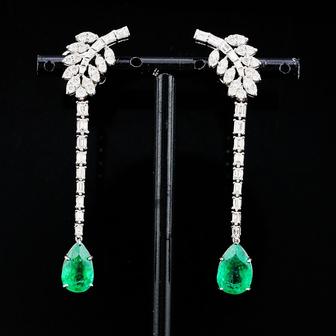 5.60ctw Emerald, 2.50ctw Diamond and 18K Earrings: 5.60ctw Emerald, 2.50ctw VS1-SI1/G-H Diamond and 18K White Gold 2.5" Linear Drop Earrings - THIS ITEM WILL COME WITH A $28,000 INSURANCE VALUATION REPORT. Elegantly crafted in luxurious 18K white gold