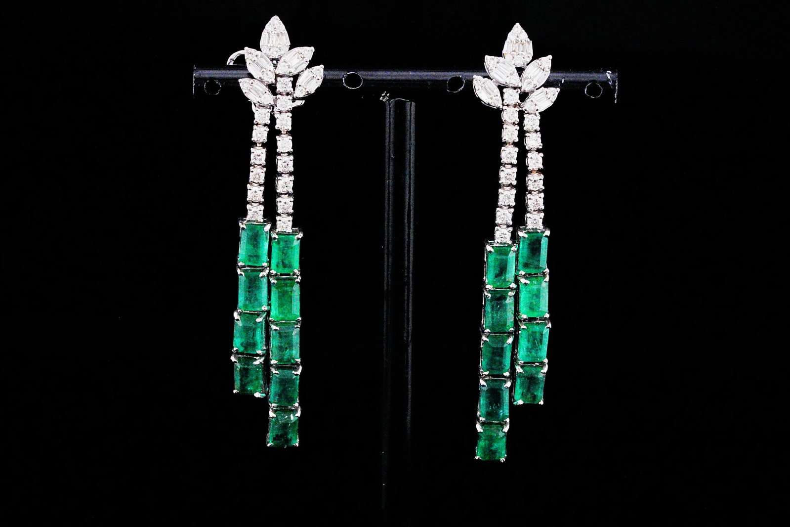 11.30ctw Emerald, 1.50ctw Diamond and 18K Earrings: 11.30ctw Emerald, 1.50ctw VS1-SI1/G-H Diamond and 18K White Gold 2.60" Tassel Drop Earrings - THIS ITEM WILL COME WITH A $28,500 INSURANCE VALUATION REPORT. Exquisitely crafted in luxurious 18K white 