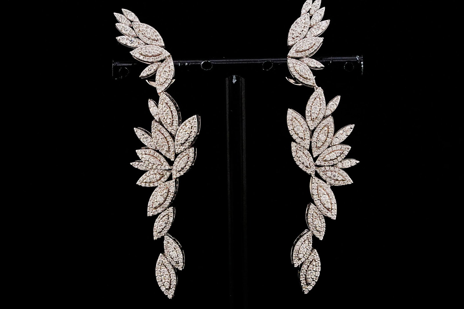 3.10ctw SI1-SI2/G-H Diamond and 18K 3" Earrings: 3.10ctw SI1-SI2/G-H Diamond and 18K White Gold 3" Botanical Vine Earrings - THIS ITEM WILL COME WITH A $23,000 INSURANCE VALUATION REPORT. Gracefully designed in a cascading botanical vine motif, thes