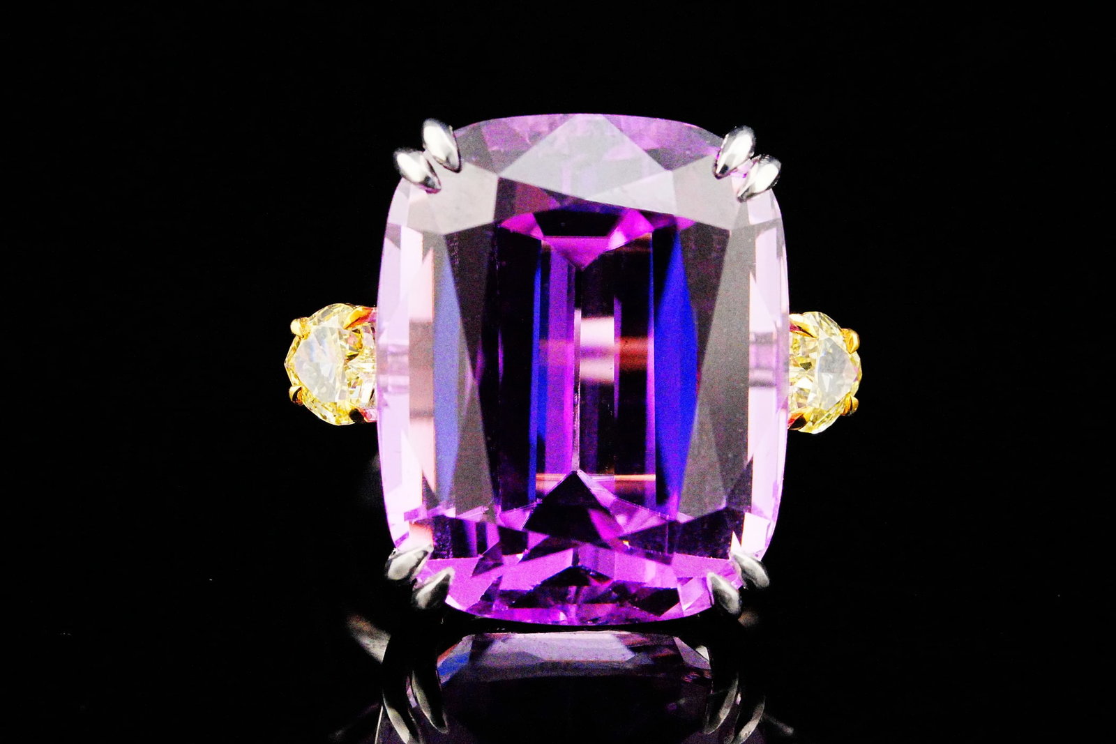 40ct Kunzite, 0.85ctw Fancy Yellow Diamond and 18K Ring: 40.00ct Kunzite, 0.85ctw VS Fancy Yellow Diamond and 18K White/Yellow Gold Ring - THIS ITEM WILL COME WITH AN $18,000 INSURANCE VALUATION REPORT. A truly extraordinary statement of scale, rarity, and 