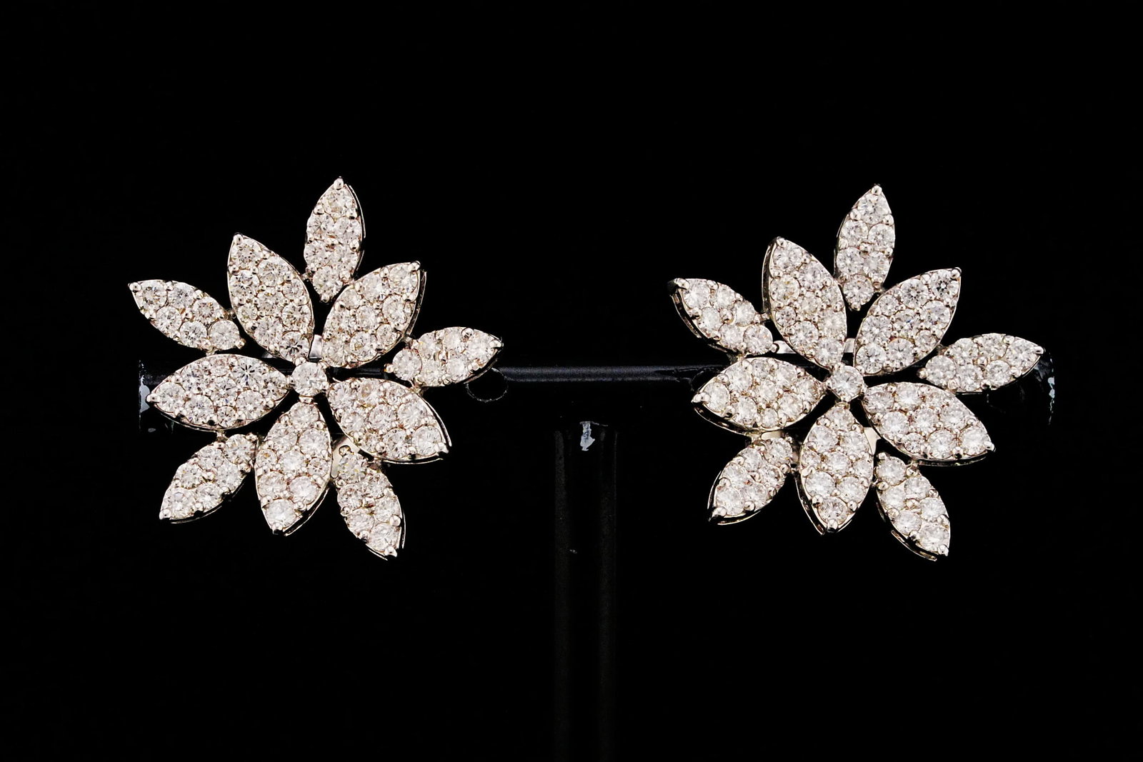 3.75ctw VS2-SI1/G-H Diamond and 18K 1" Earrings: 3.75ctw VS2-SI1/G-H Diamond and 18K White Gold 1" Floral Cluster Earrings - THIS ITEM WILL COME WITH A $15,000 INSURANCE VALUATION REPORT. These elegant floral cluster earrings showcase approximately 