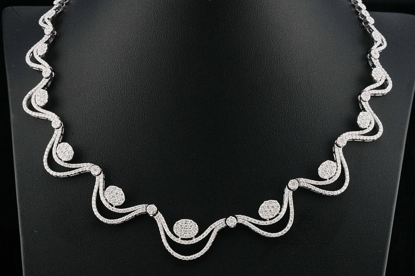 9.00ctw VS1-SI1/G-H Diamond and 18K 16" Swag Necklace: 9.00ctw VS1-SI1/G-H Diamond and 18K White Gold 16" Swag Necklace - THIS ITEM WILL COME WITH A $39,000 INSURANCE VALUATION REPORT. An exquisite statement of refined elegance, this exceptional swag neck