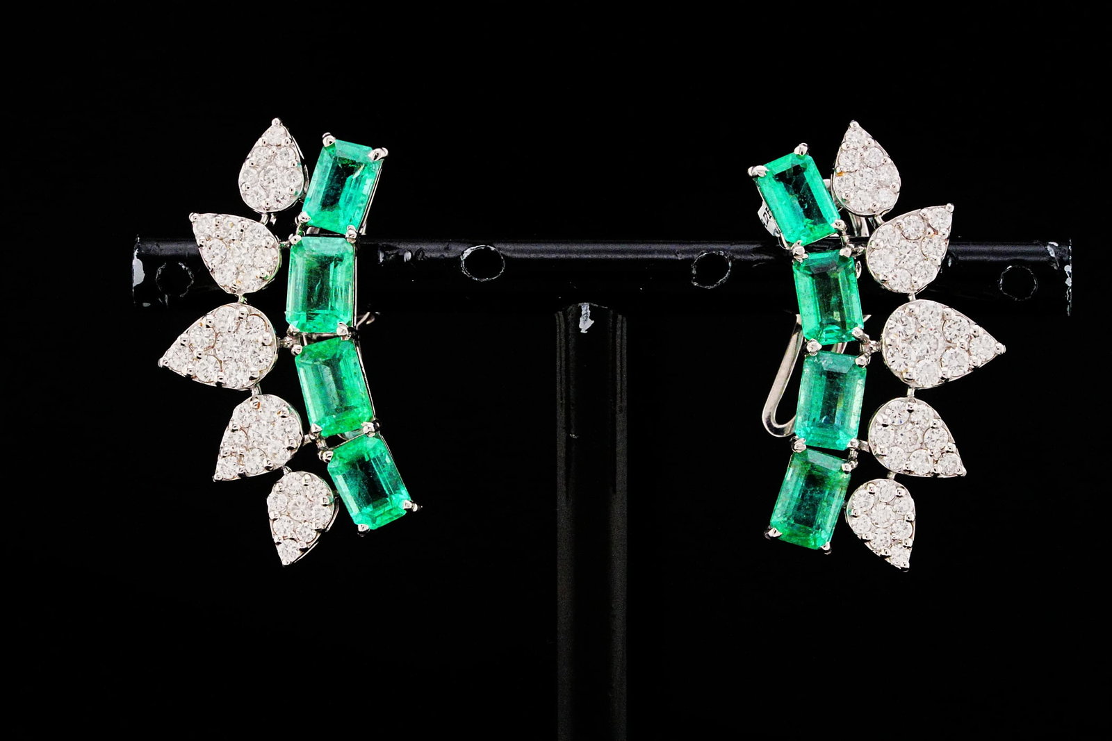 4.25ctw Emerald, 1.35ctw Diamond and 18K Earrings: 4.25ctw Emerald, 1.35ctw VS2-SI1/G-H Diamond and 18K White Gold 1.10" Earrings - THIS ITEM WILL COME WITH A $12,500 INSURANCE VALUATION REPORT. Contemporary versatility meets exceptional craftsmanship