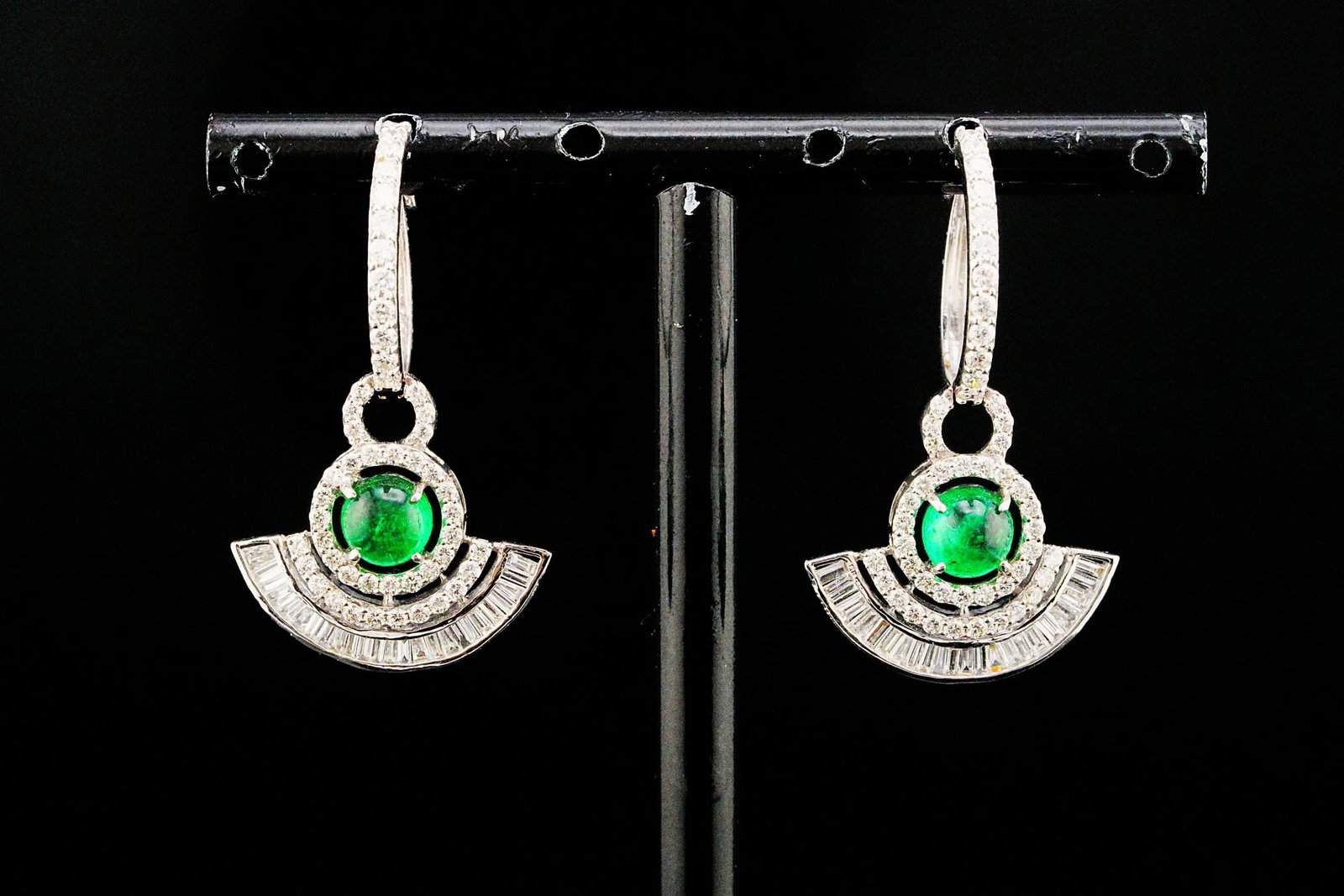 1.55ctw Emerald, 1.50ctw Diamond and 18K 1.25" Earrings: 1.55ctw Emerald, 1.50ctw VS2-SI1/G-H Diamond and 18K White Gold 1.25" Drop Earrings - THIS ITEM WILL COME WITH AN $8,500 INSURANCE VALUATION REPORT. Elegant geometry and vibrant color come together in