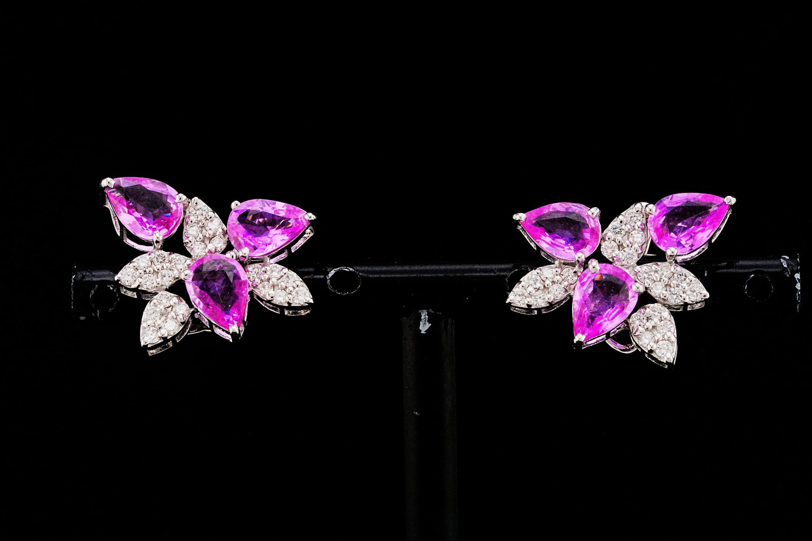 3.90ctw Pink Sapphire, 0.50ctw Diamond, 18K Earrings: 3.90ctw Pink Sapphire, 0.50ctw VS1-VS2/G-H Diamond and 18K White Gold 0.80" Cluster Earrings - THIS ITEM WILL COME WITH AN $11,000 INSURANCE VALUATION REPORT. Showcasing approximately 3.90 carats tota