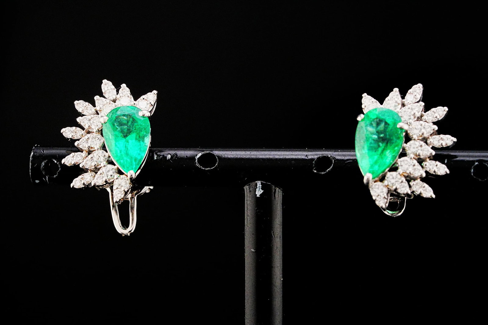 2.50ctw Emerald, 0.75ctw Diamond and 18K Earrings: 2.50ctw Emerald, 0.75ctw VS1-SI1/G-H Diamond and 18K White Gold 0.60" Spray Earrings - THIS ITEM WILL COME WITH AN $11,000 INSURANCE VALUATION REPORT. Showcasing approximately 2.50 carats total weight