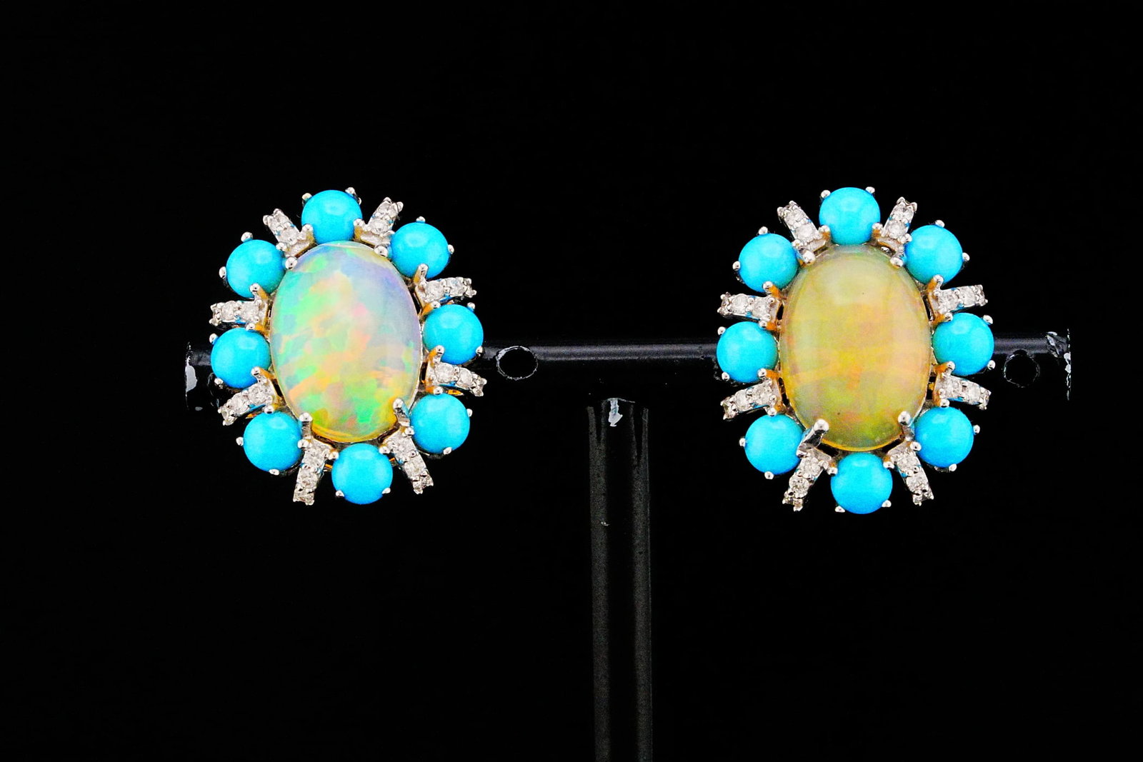 6.30ctw Opal, 4.85ctw Turquoise, Diamond and 18K Earrings: 6.30ctw Opal, 4.85ctw Turquoise, 0.50ctw Diamond and 18K White Gold 1" Earrings - THIS ITEM WILL COME WITH AN $8,000 INSURANCE VALUATION REPORT. A captivating blend of vibrant color and timeless elega