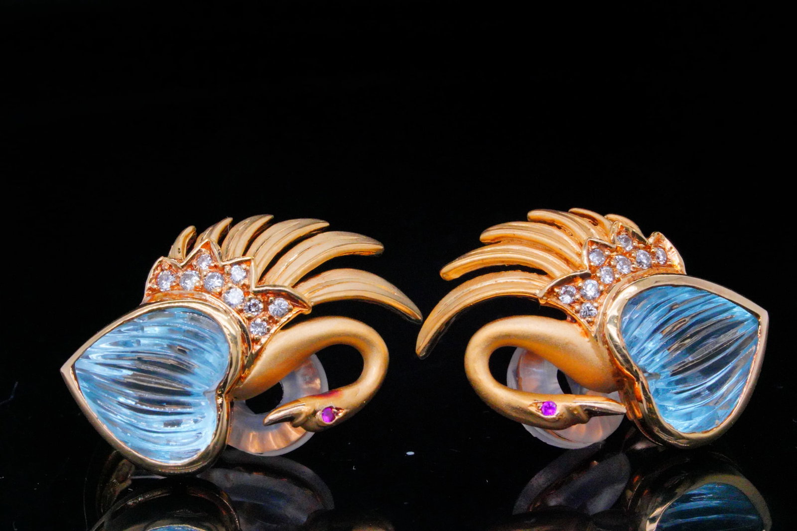 Carrera y Carrera 18K, Topaz and Diamond Ear Clips: Carrera y Carrera 18K Yellow Gold, Blue Topaz and Diamond 1" Swan Ear Clips - Exude elegance with these stunning ear clips from Carrera y Carrera. Crafted in 18K Yellow Gold, the earrings are beautifu
