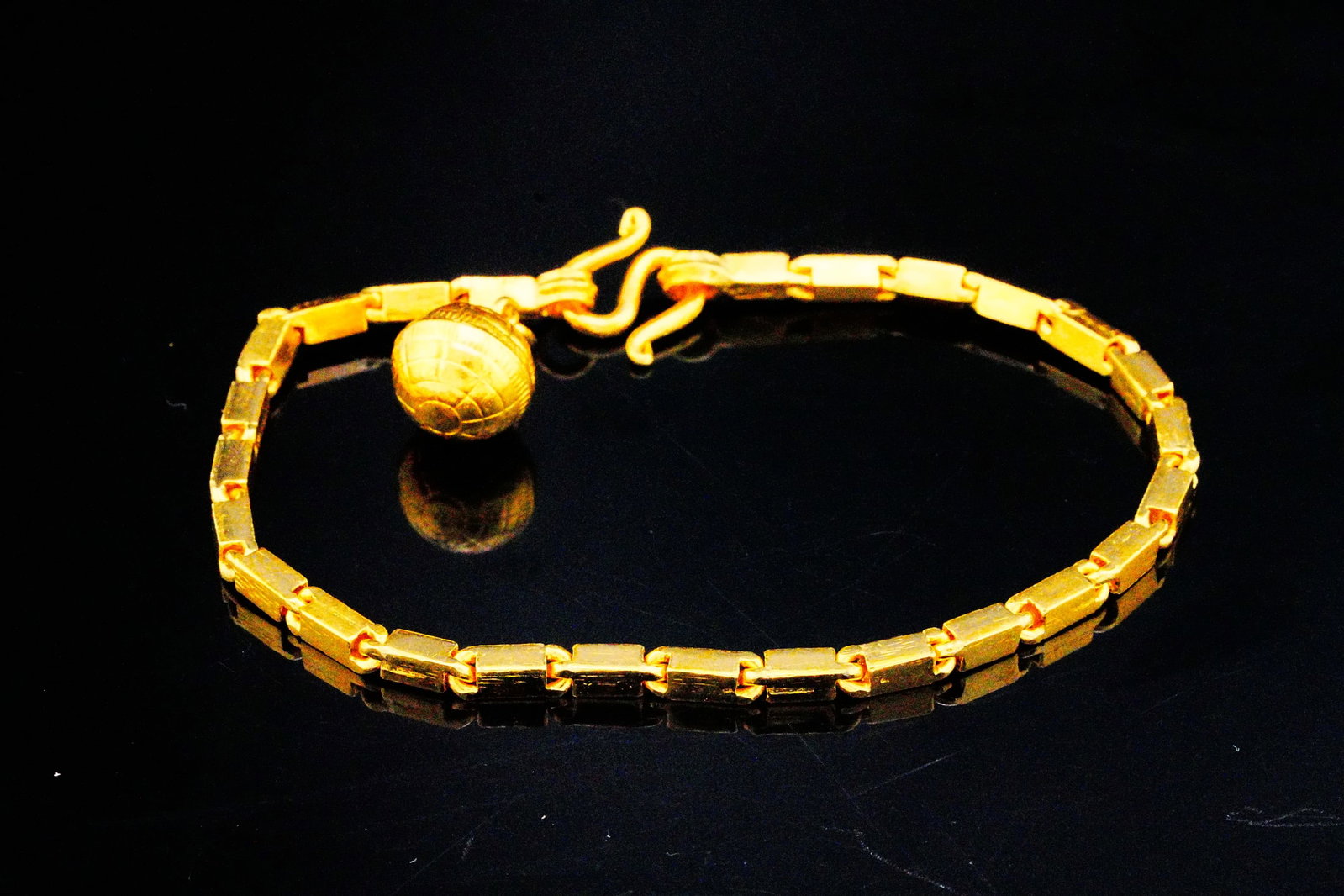 Solid 22K Yellow Gold 7" Link Bracelet (15.2 Grams): Solid 22K Yellow Gold 7" Link Bracelet W/Orb Charm - A sleek and sophisticated expression of high-karat luxury, this finely crafted 22K gold bracelet showcases a clean geometric link design that exude