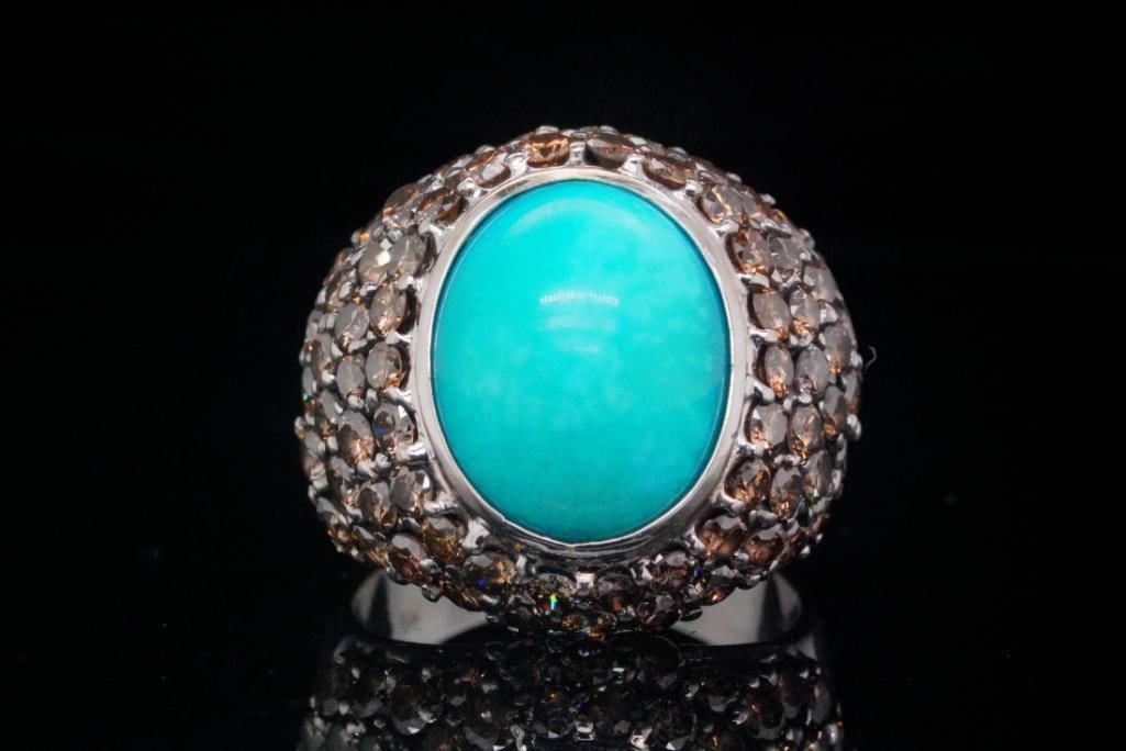 13.5mm Turquoise, 3.25ctw Brown Diamond, 18K Ring: 13.5mm Turquoise, 3.25ctw Brown Diamond and 18K White Gold Ring - This striking ring showcases a bold and luxurious combination of color and brilliance, making it a standout statement piece. At its ce