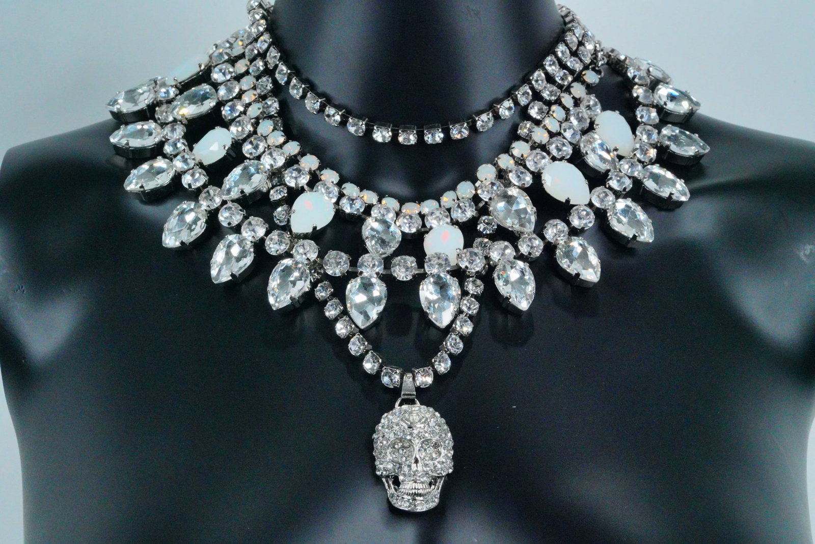 Philipp Plein Rhinestone Crystal Skull Necklace Set: Philipp Plein Silver Tone Rhinestone Crystal Skull Necklace Set - Elevate your statement jewelry collection with this bold and glamorous set by Philipp Plein. The set features four stunning necklaces,