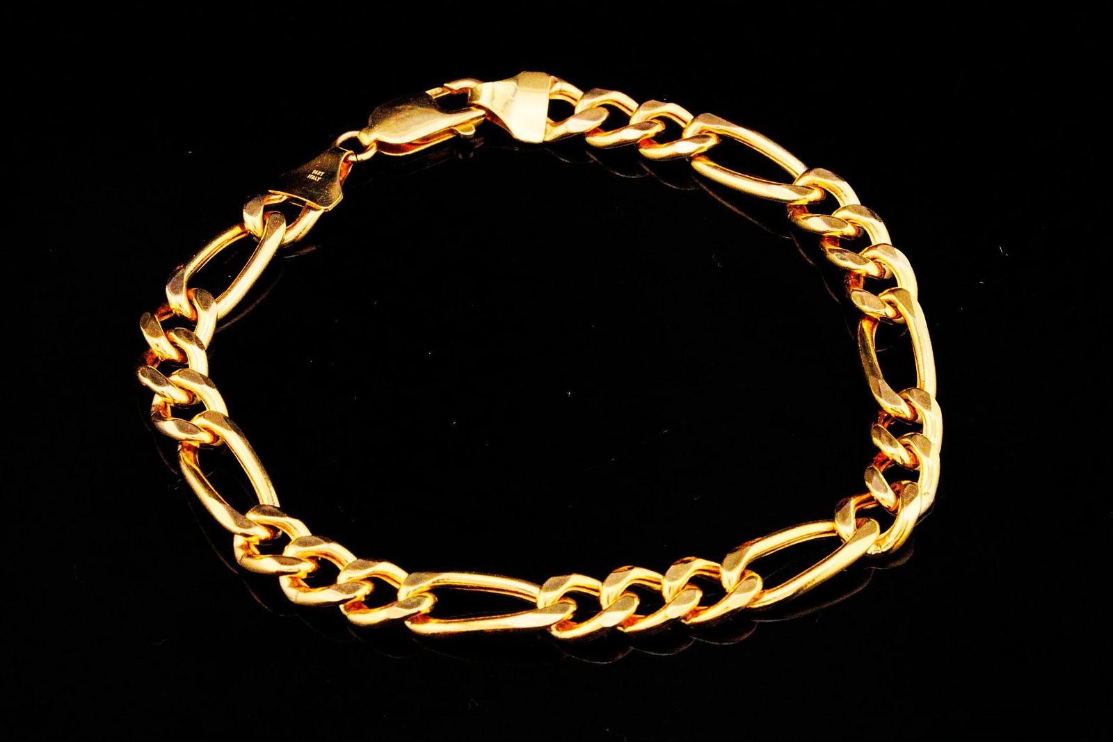 Italian 14K Yellow Gold 8.75" 7.5mm Wide Figaro Bracelet: Italian 14K Yellow Gold 8.75" 7.5mm Wide Figaro Bracelet - Expertly crafted in Italy from luxurious 14K yellow gold, this handsome 8.75-inch Figaro bracelet showcases one of the most enduring and reco